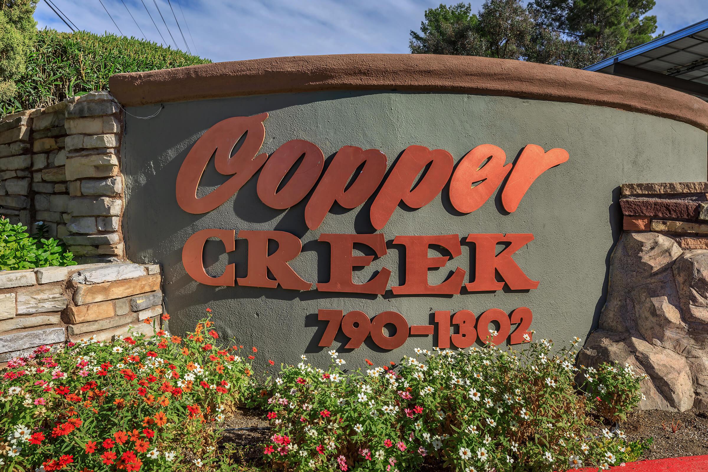 a sign in front of a brick building