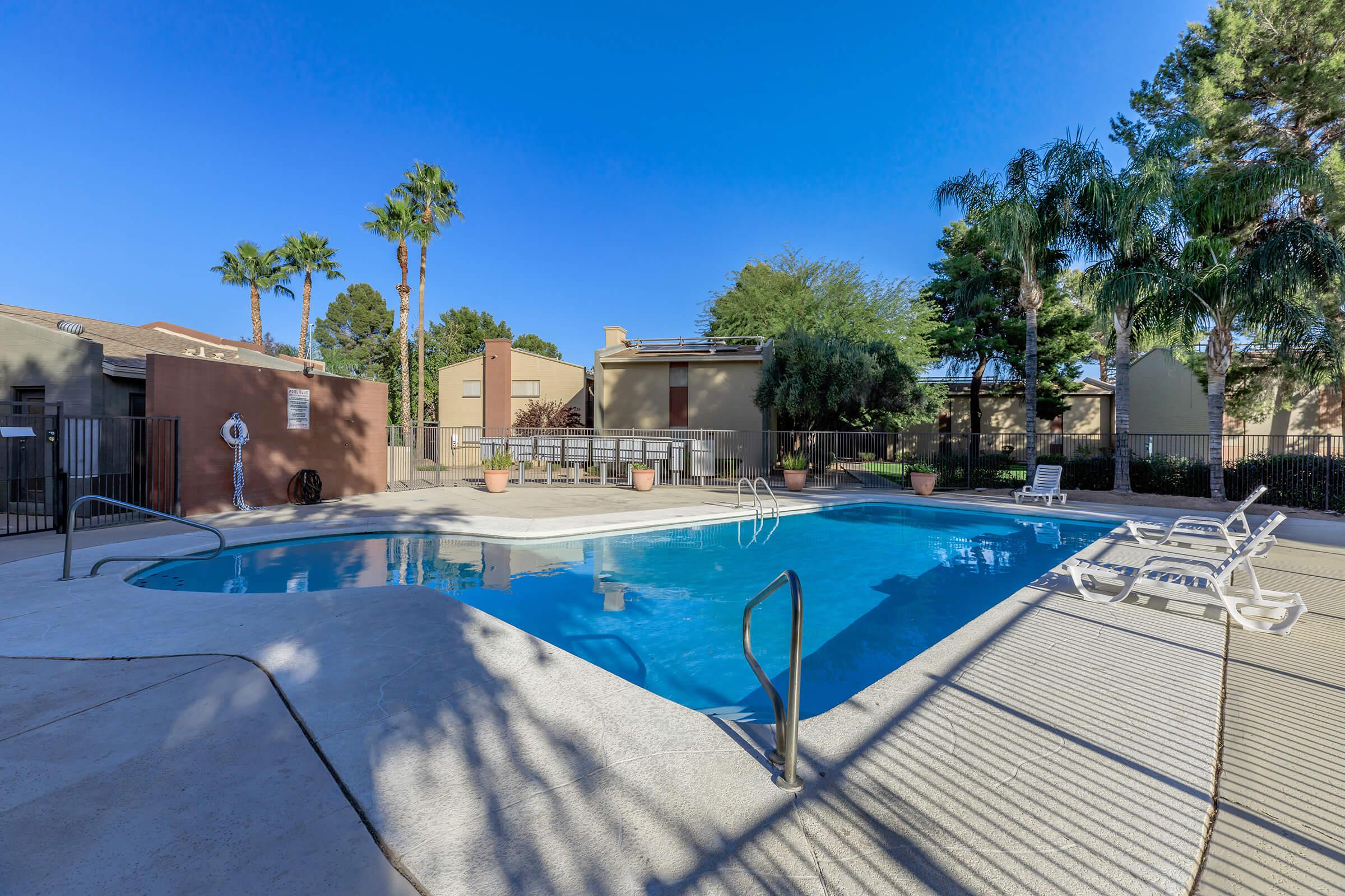 a pool next to a fence