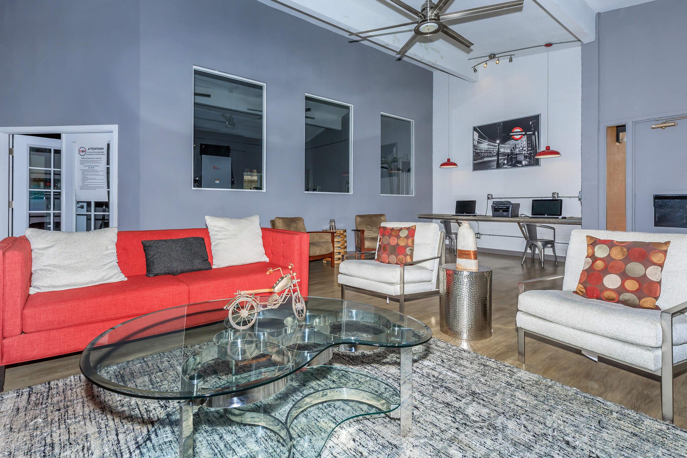 a living room filled with furniture and a fireplace