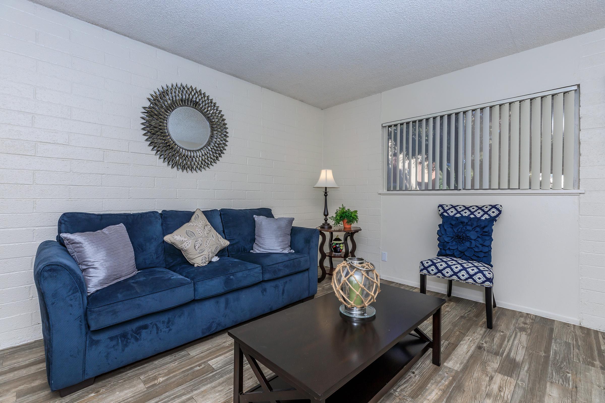 a living room filled with furniture and decor