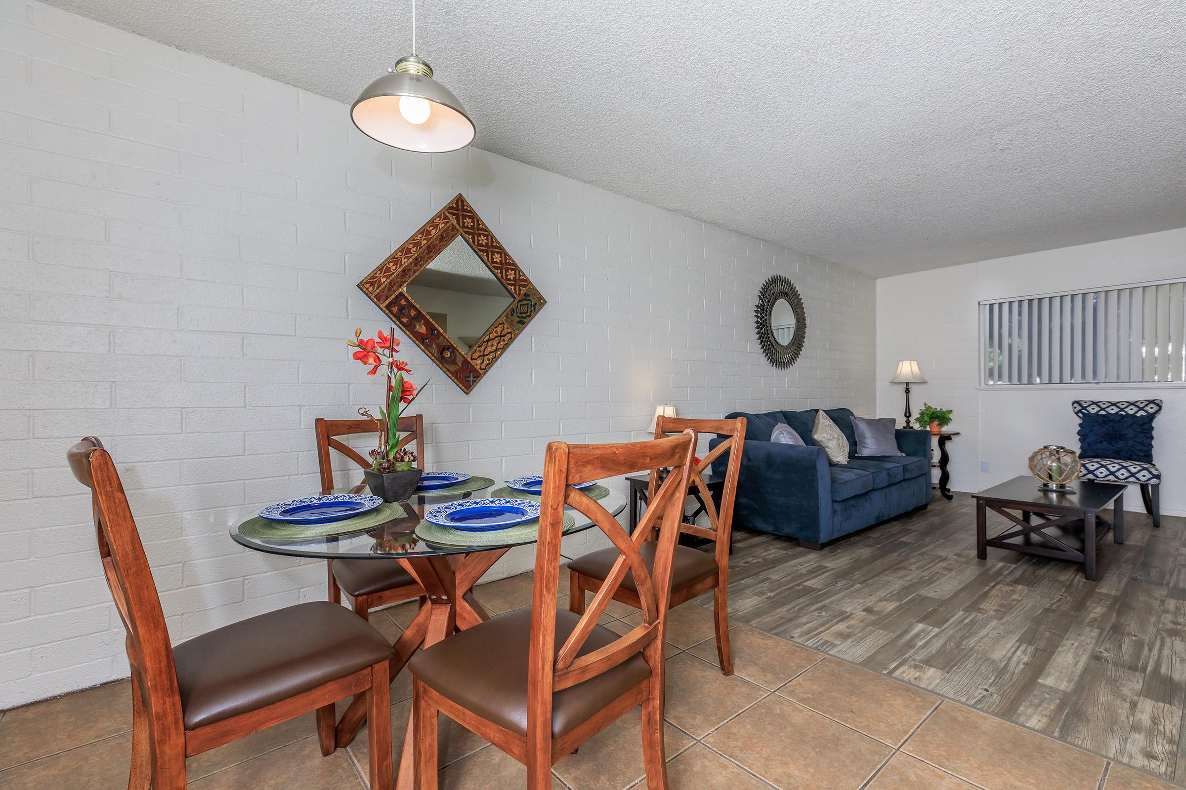 a living room filled with furniture and a table