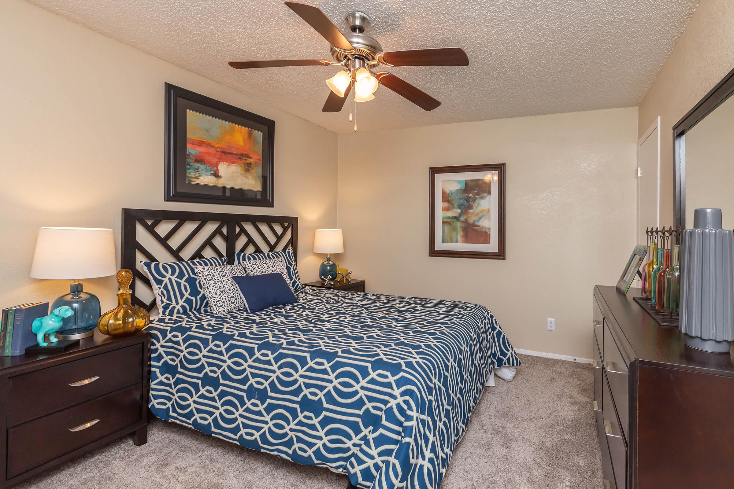 a living room filled with furniture and a bed