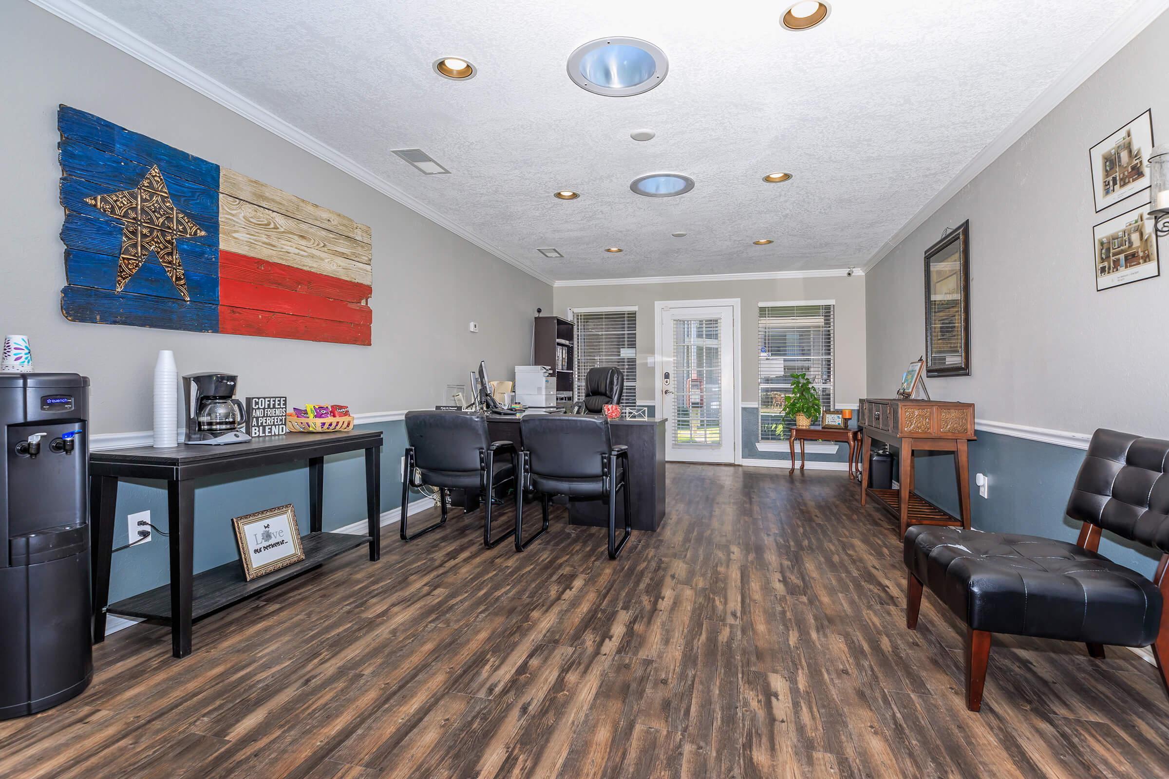 a living room filled with furniture and a flat screen tv