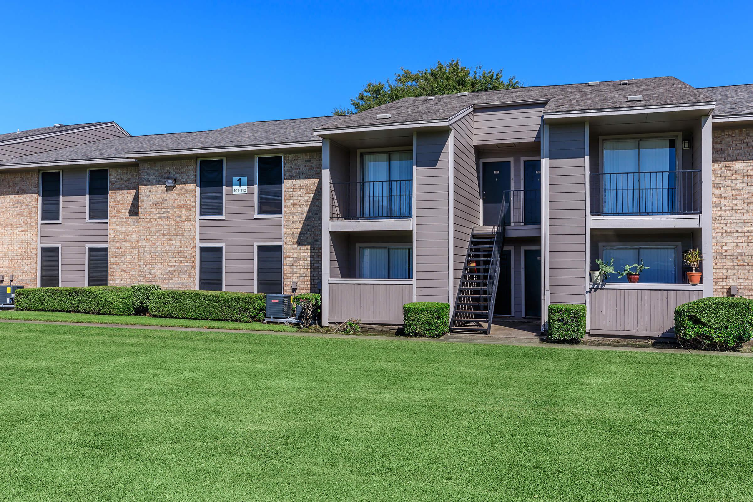 a large lawn in front of a house