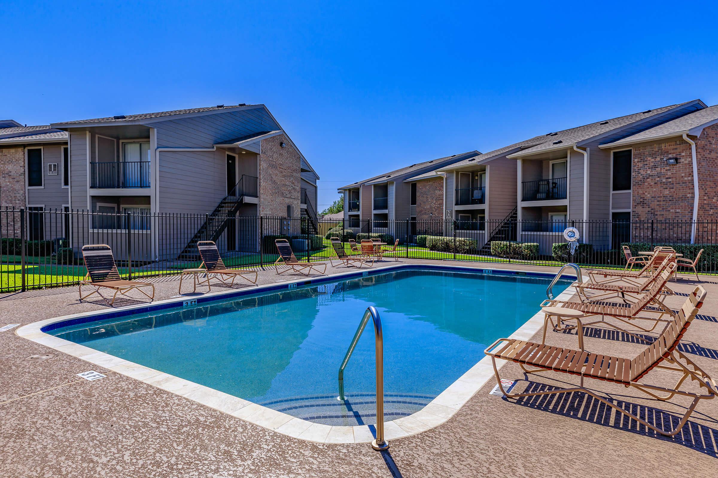 a pool of water in front of a house