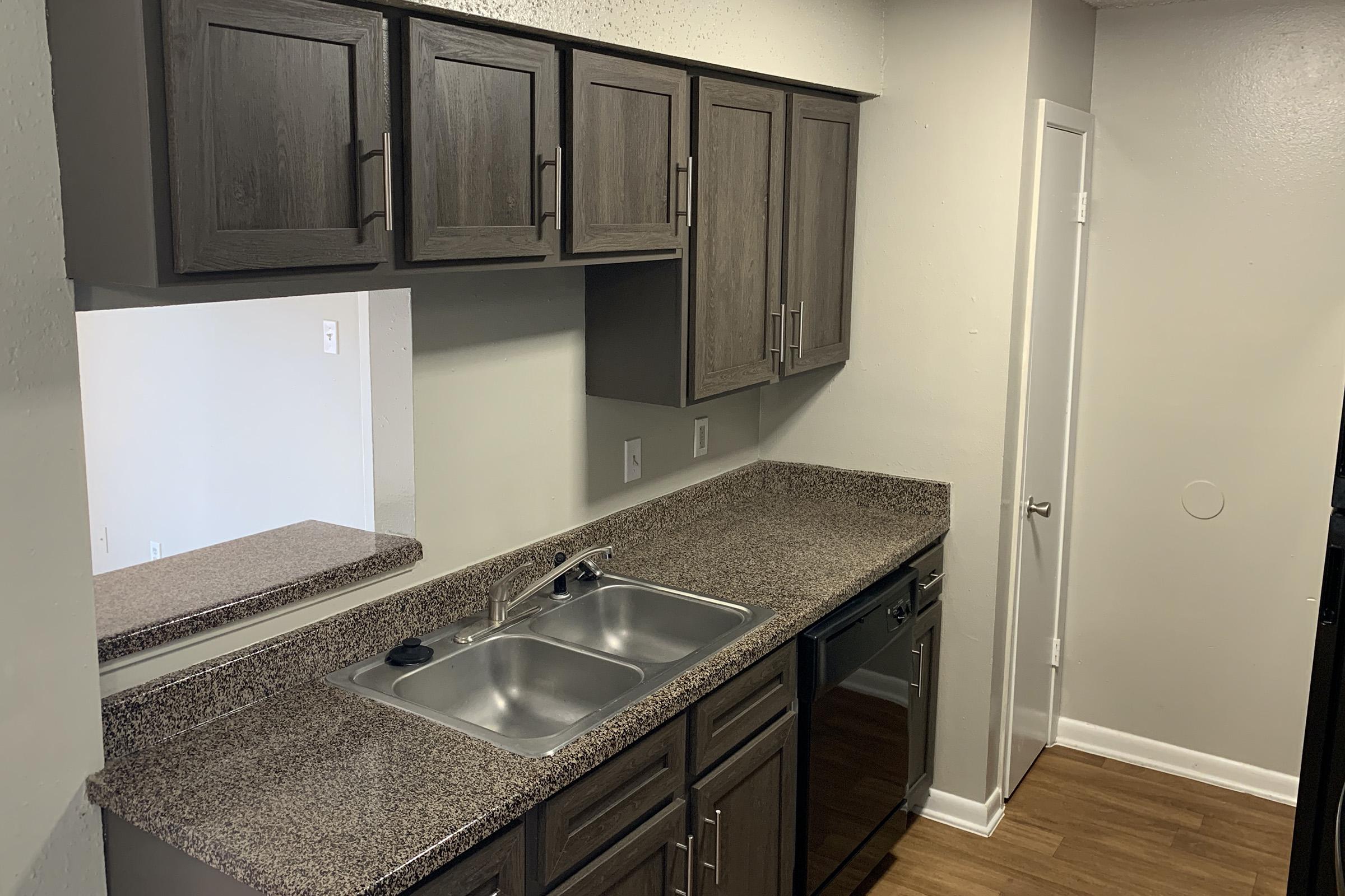 a kitchen with a stove and a sink