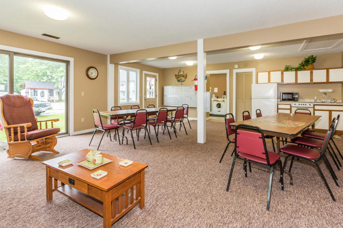 a living room filled with furniture and a table