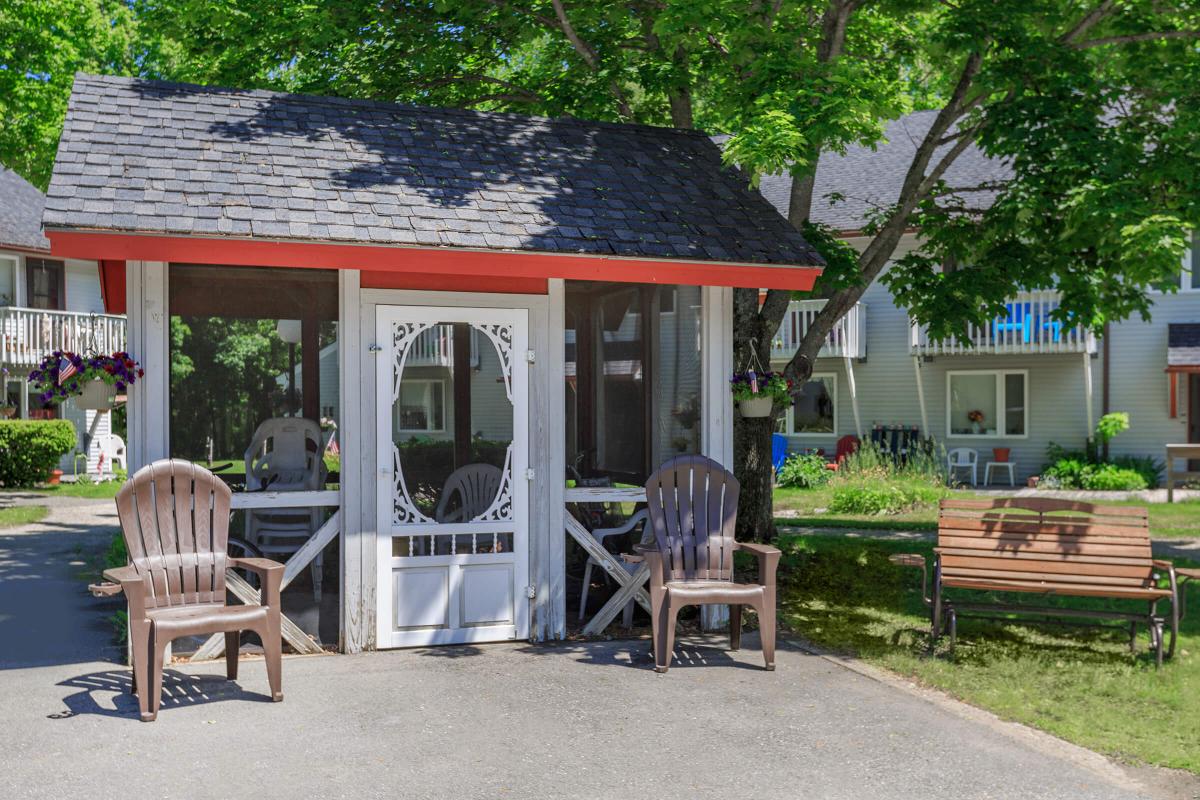 a wooden bench in front of a house