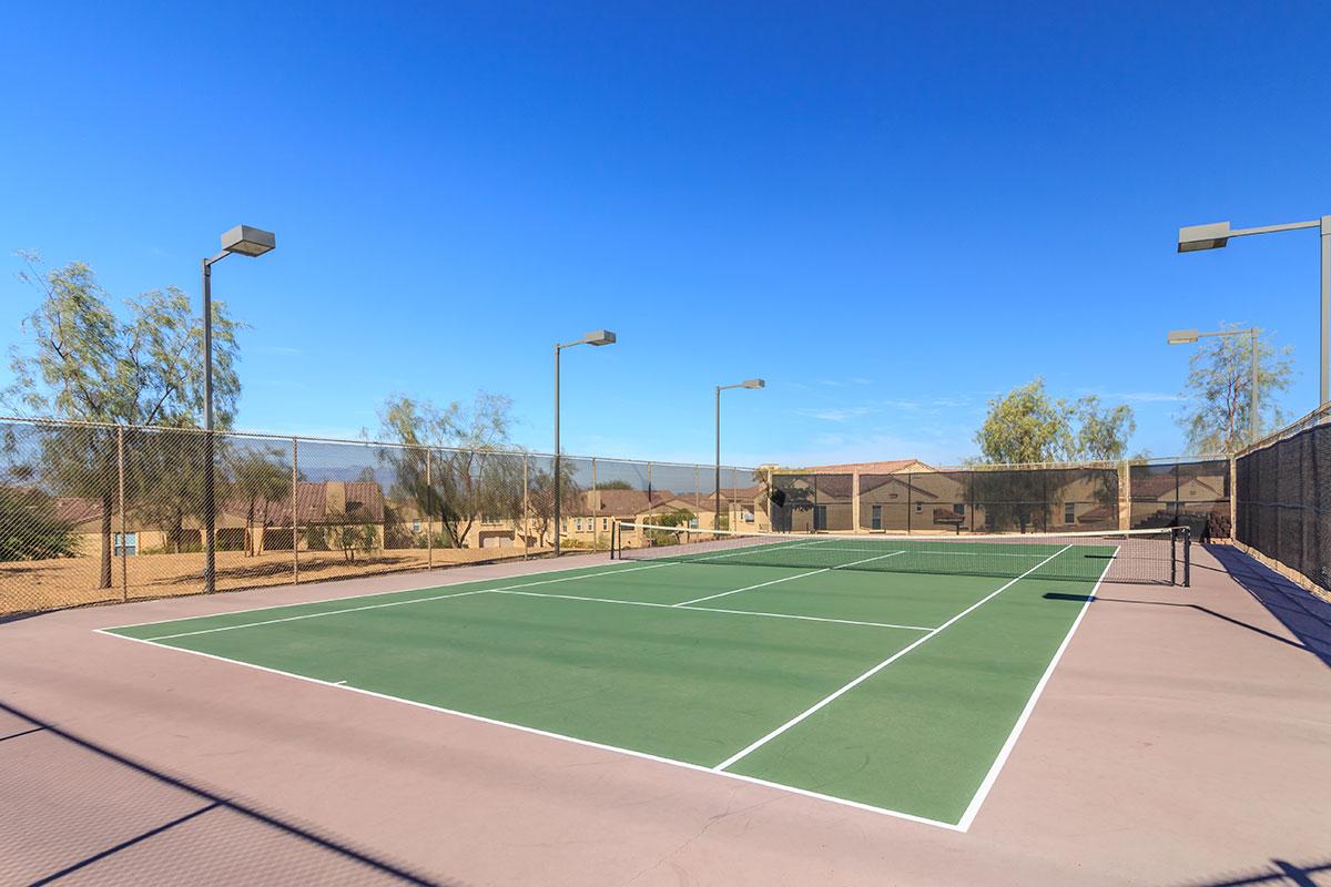 a person on a court with a racket