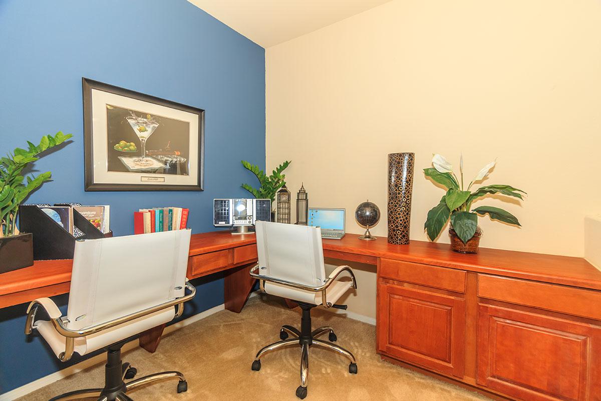 a living room filled with furniture and a flat screen tv