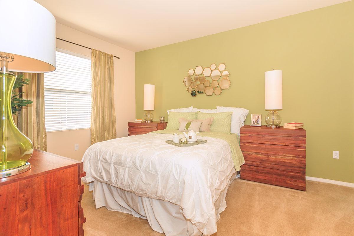 a bedroom with a large bed in a hotel room