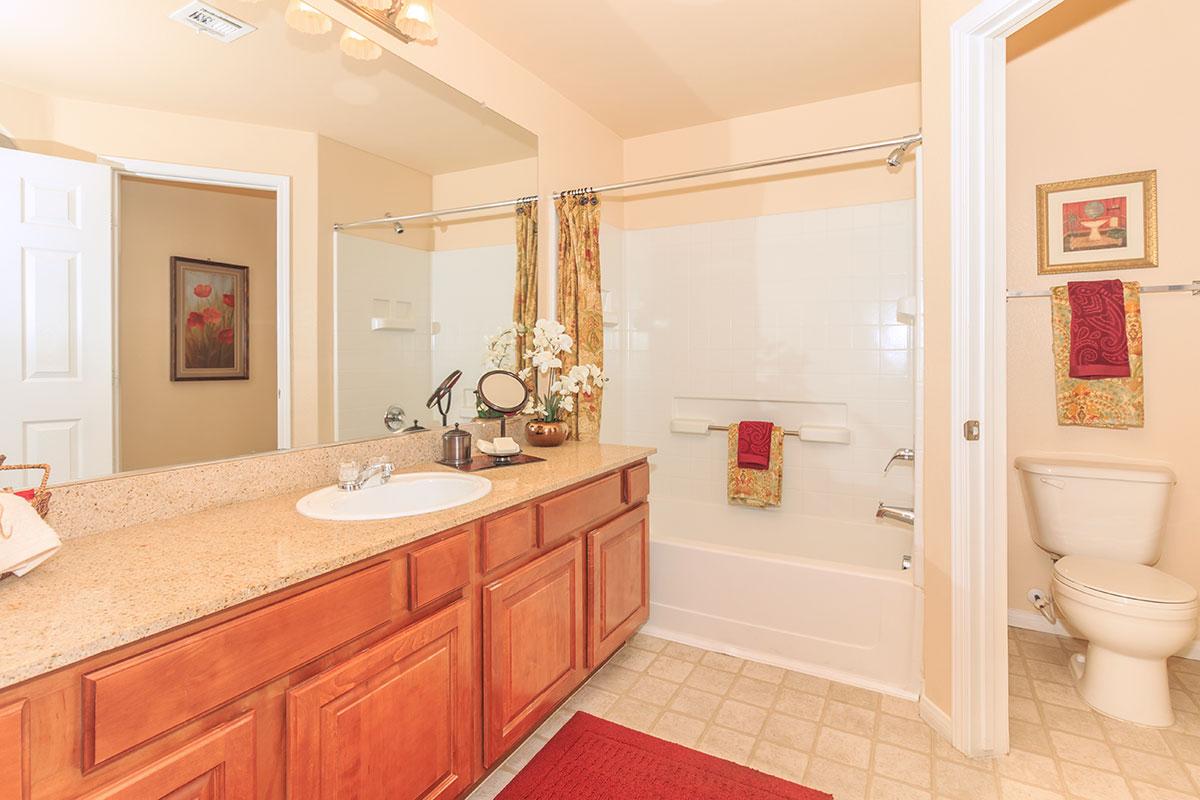 a kitchen with a sink and a mirror