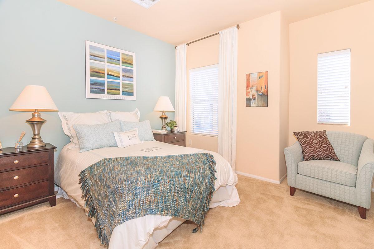 a living room filled with furniture and a bed