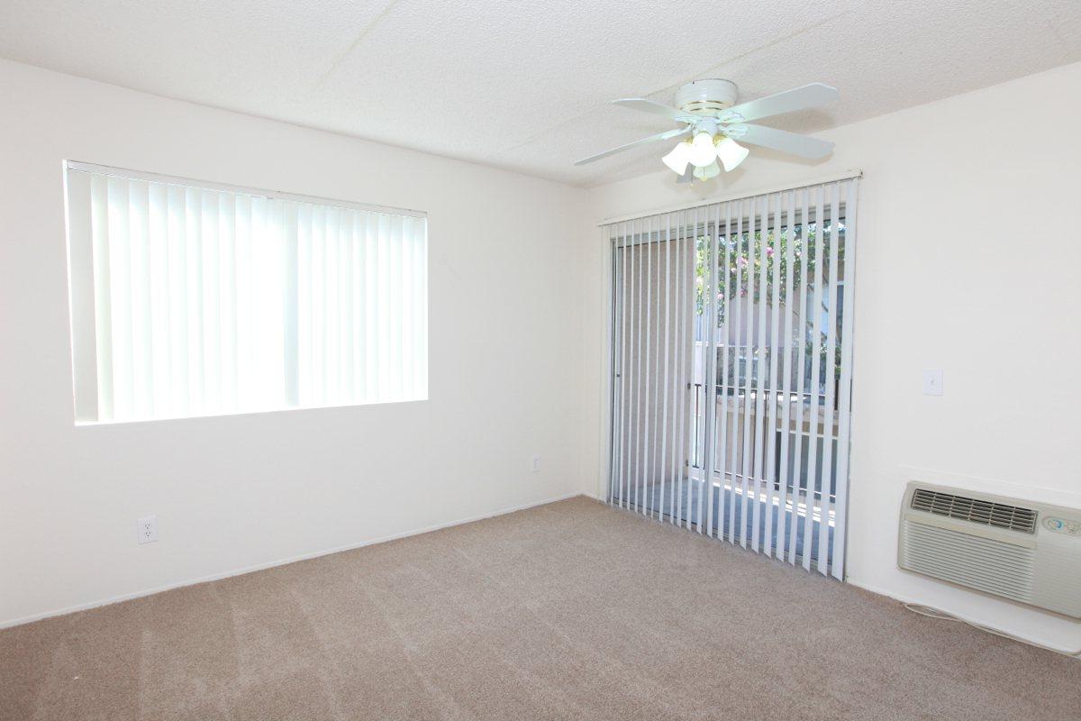 a room filled with furniture and a large window