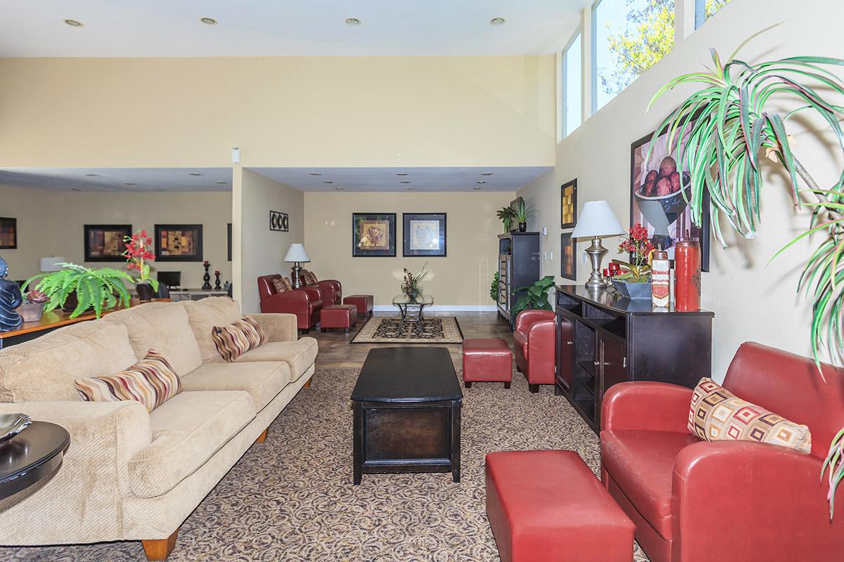 a living room filled with furniture and a fireplace