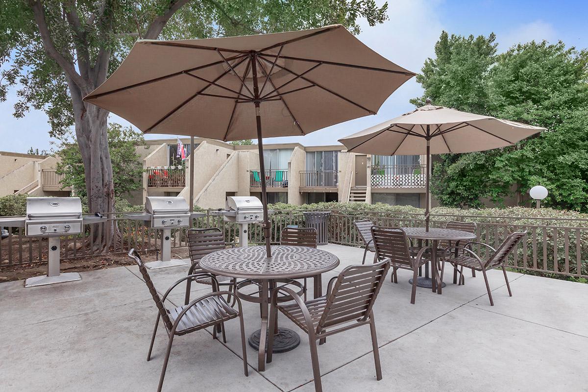 a group of lawn chairs sitting on top of a table