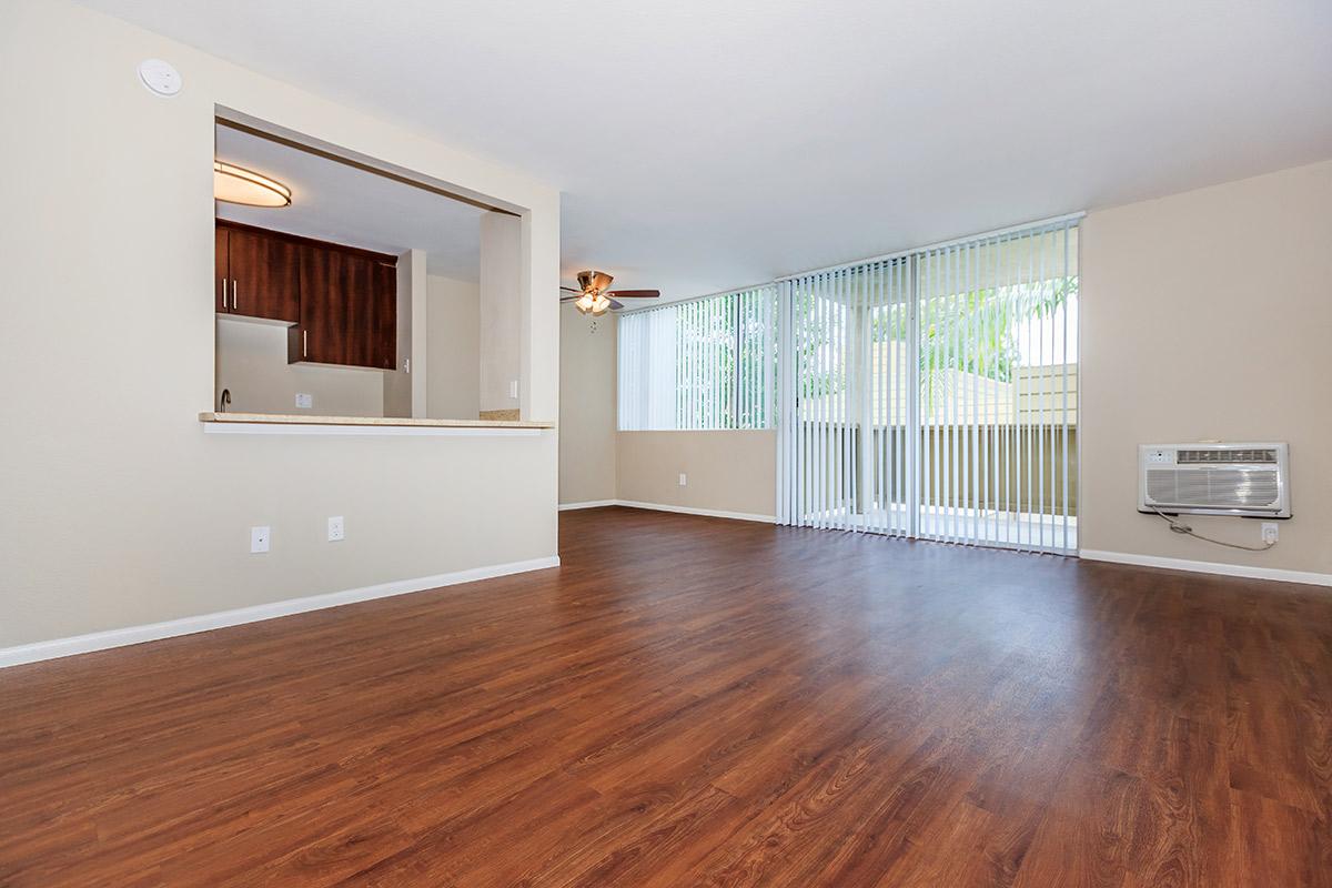 a large empty room with a wood floor