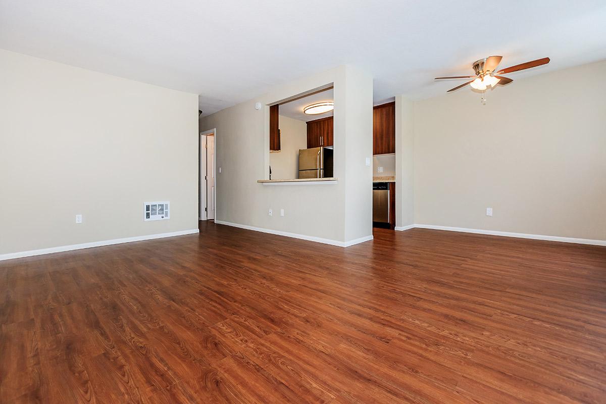 a large empty room with a wood floor