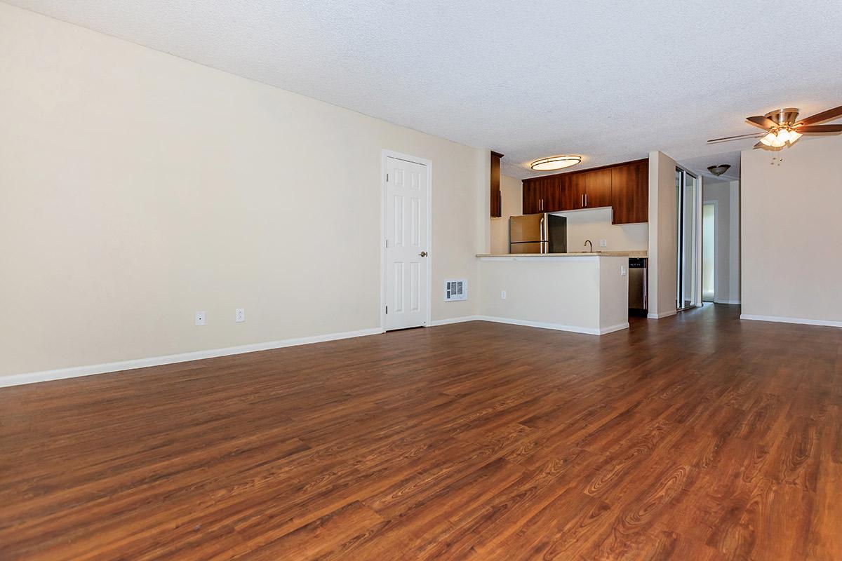 a large empty room with a wood floor