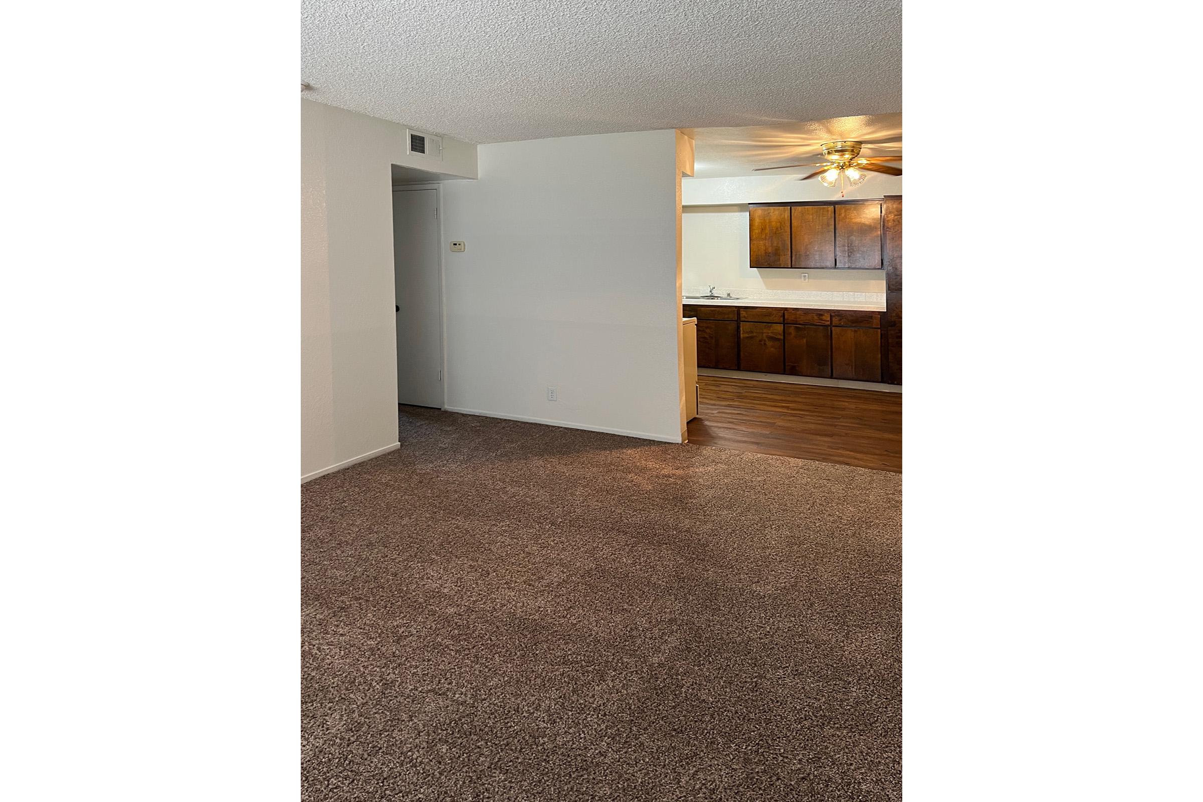 Vacant apartment with carpeting