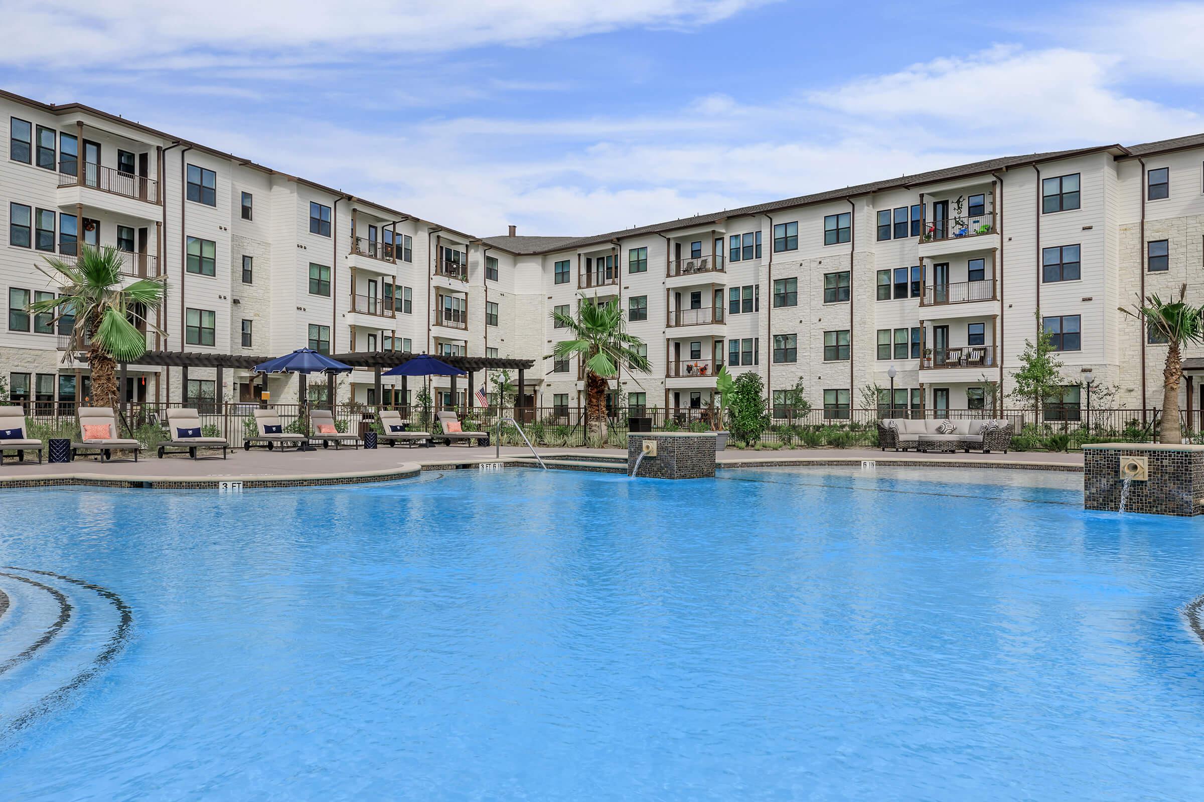 a large pool of water in front of a building