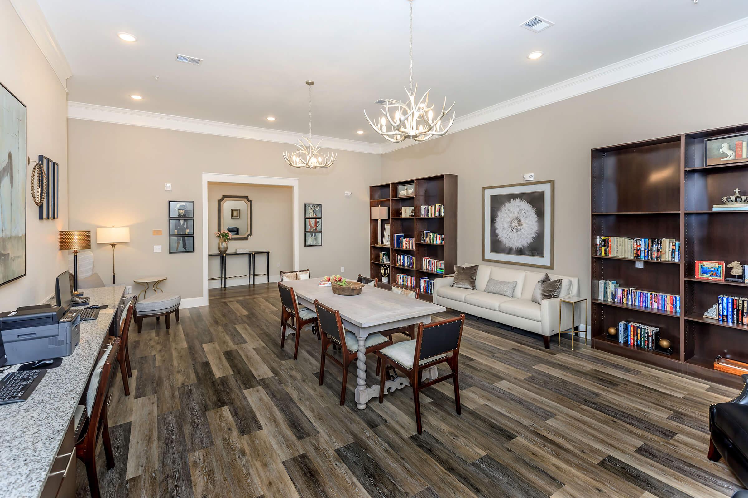 a living room filled with furniture and a flat screen tv