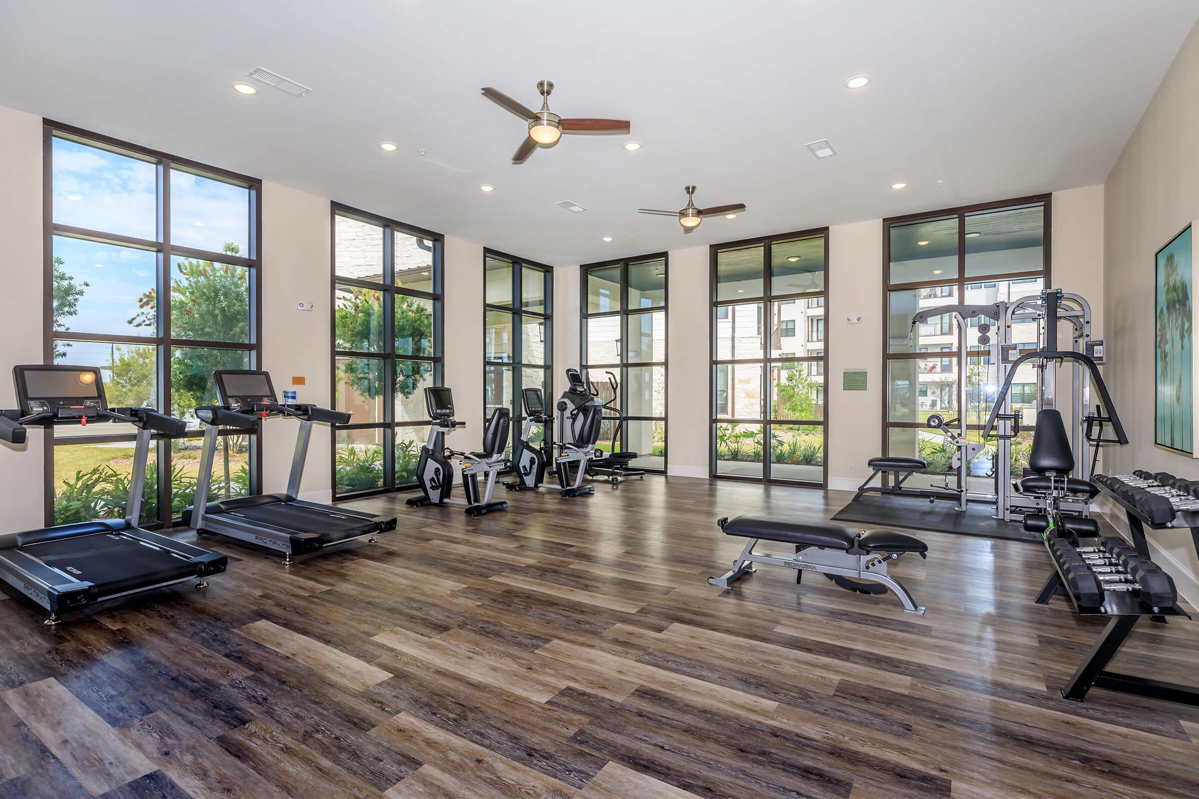 a living room filled with furniture and a large window