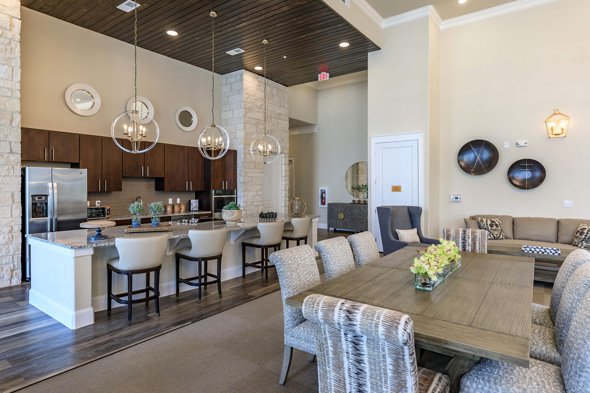 a living room filled with furniture and a table