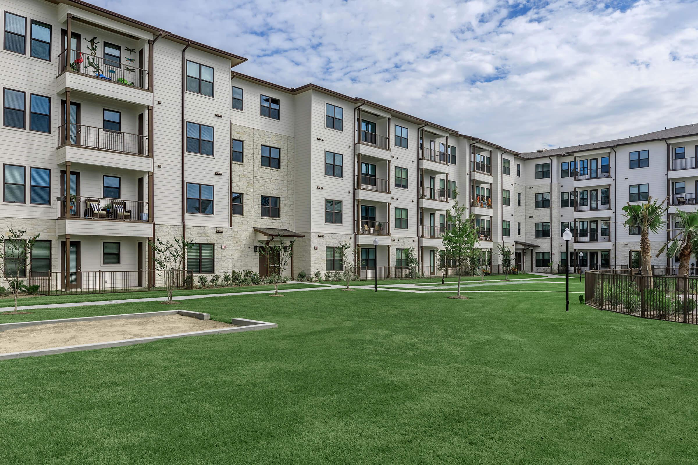 a large lawn in front of a building