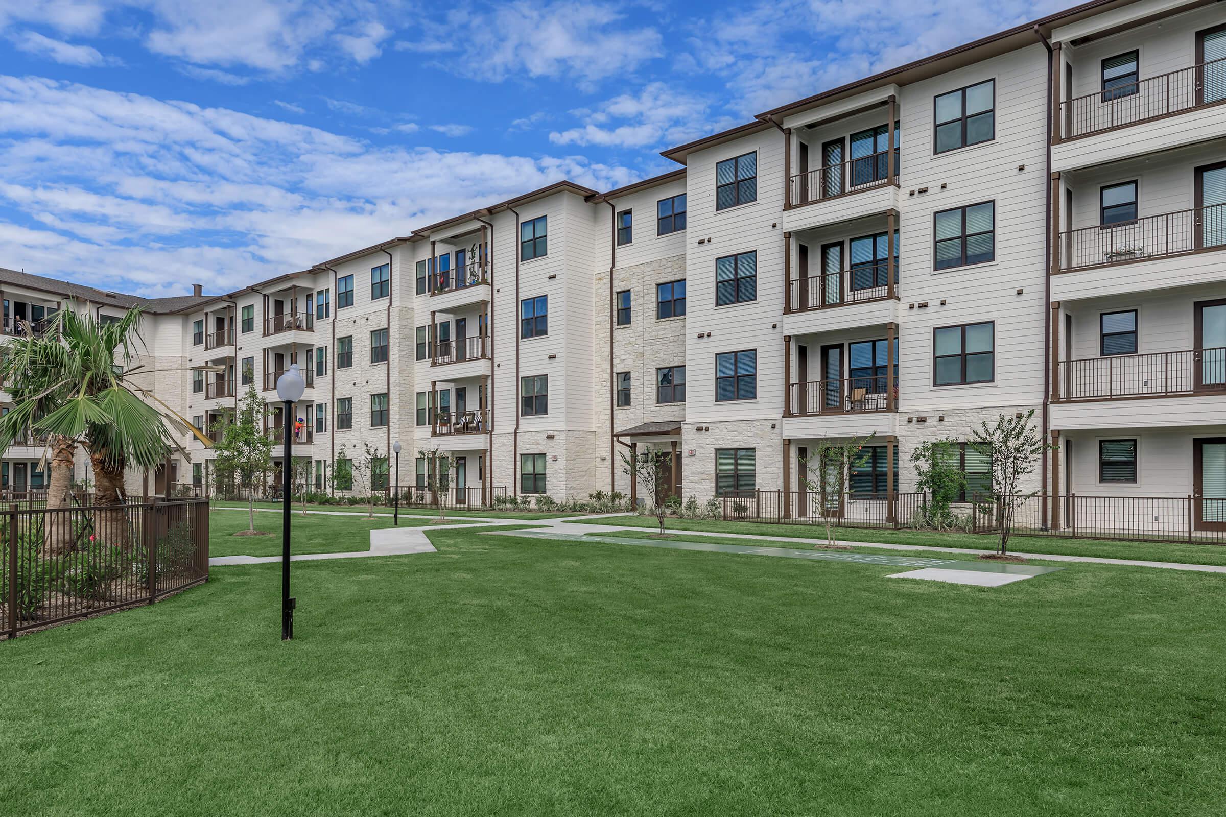 a large lawn in front of a building