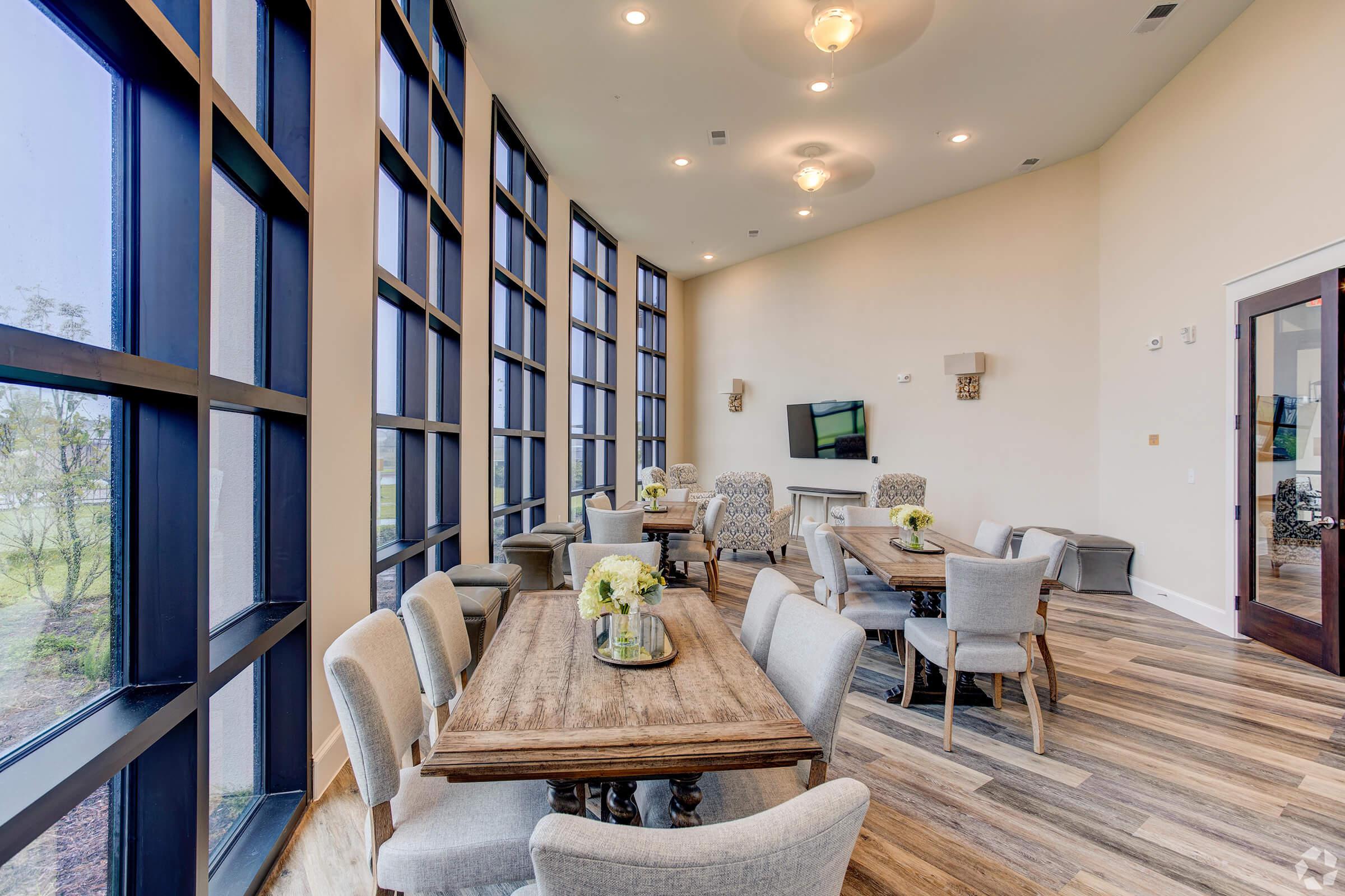 a living room filled with furniture and a large window