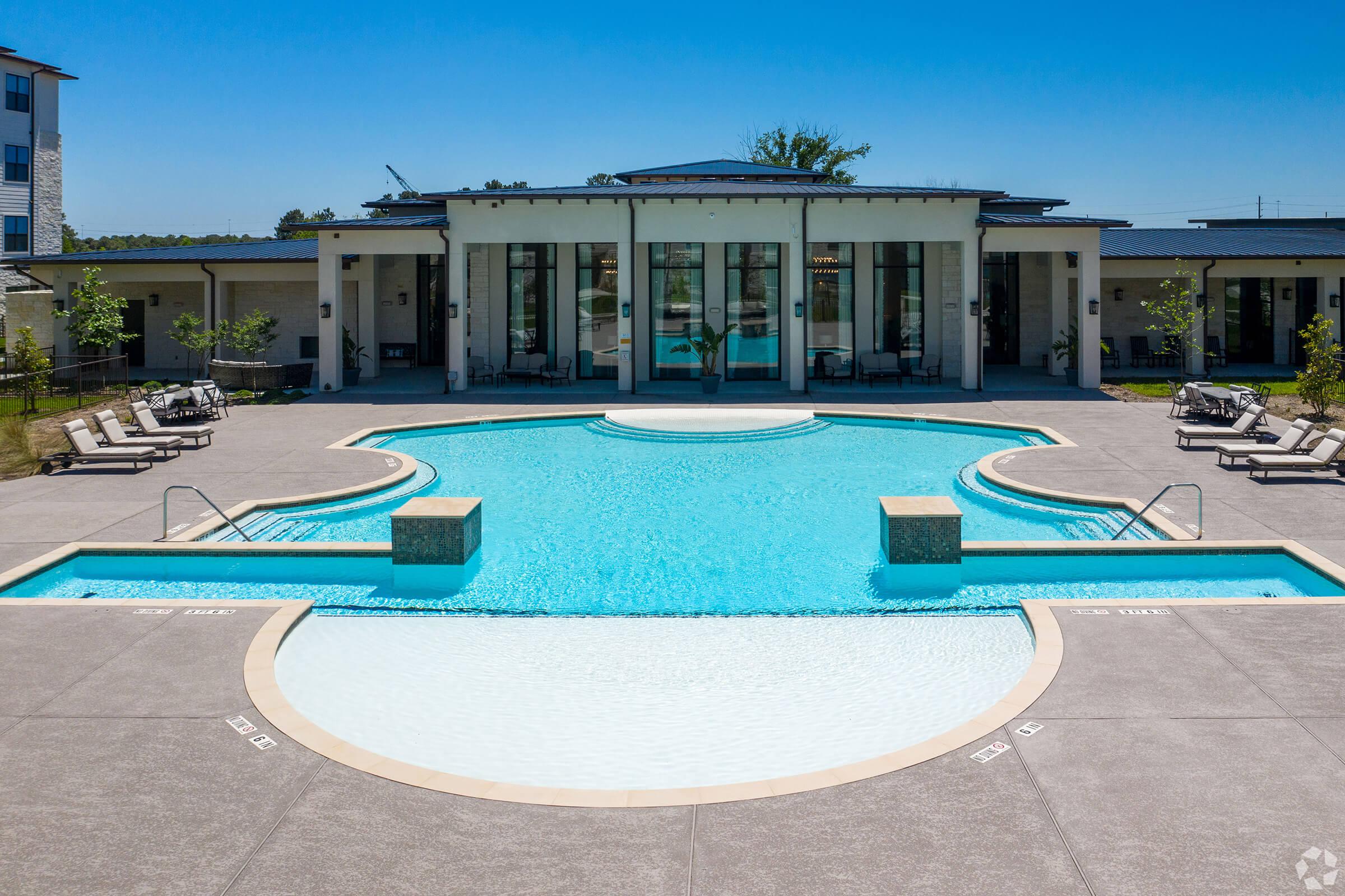 a pool in front of a building