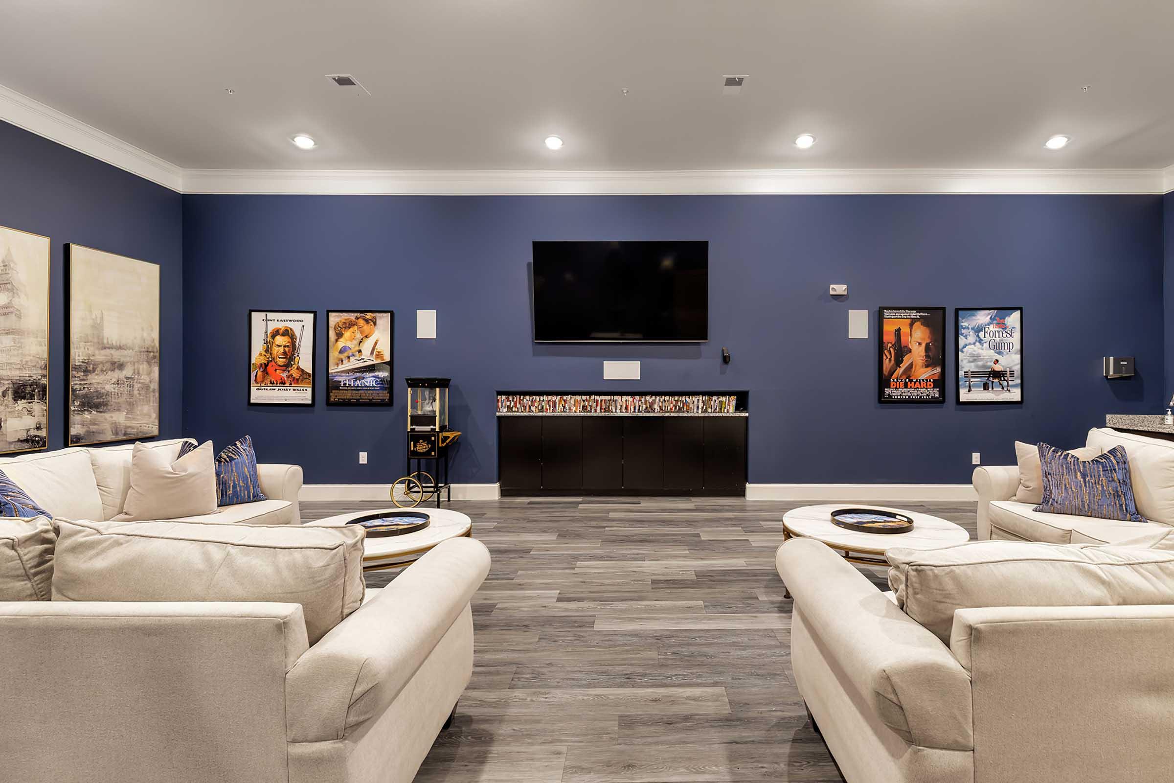 a living room filled with furniture and a flat screen tv