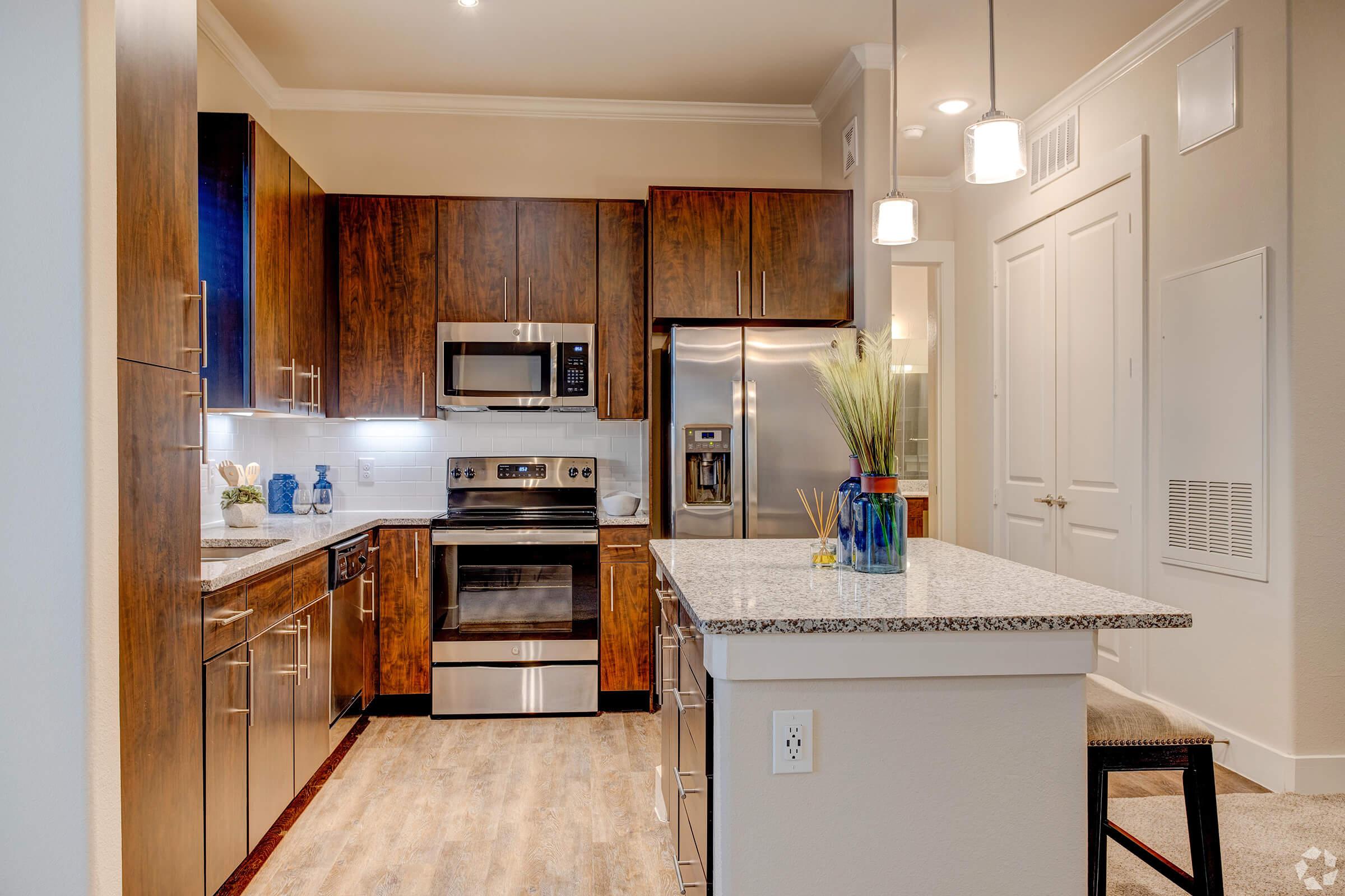 a kitchen with a stove top oven sitting inside of a refrigerator