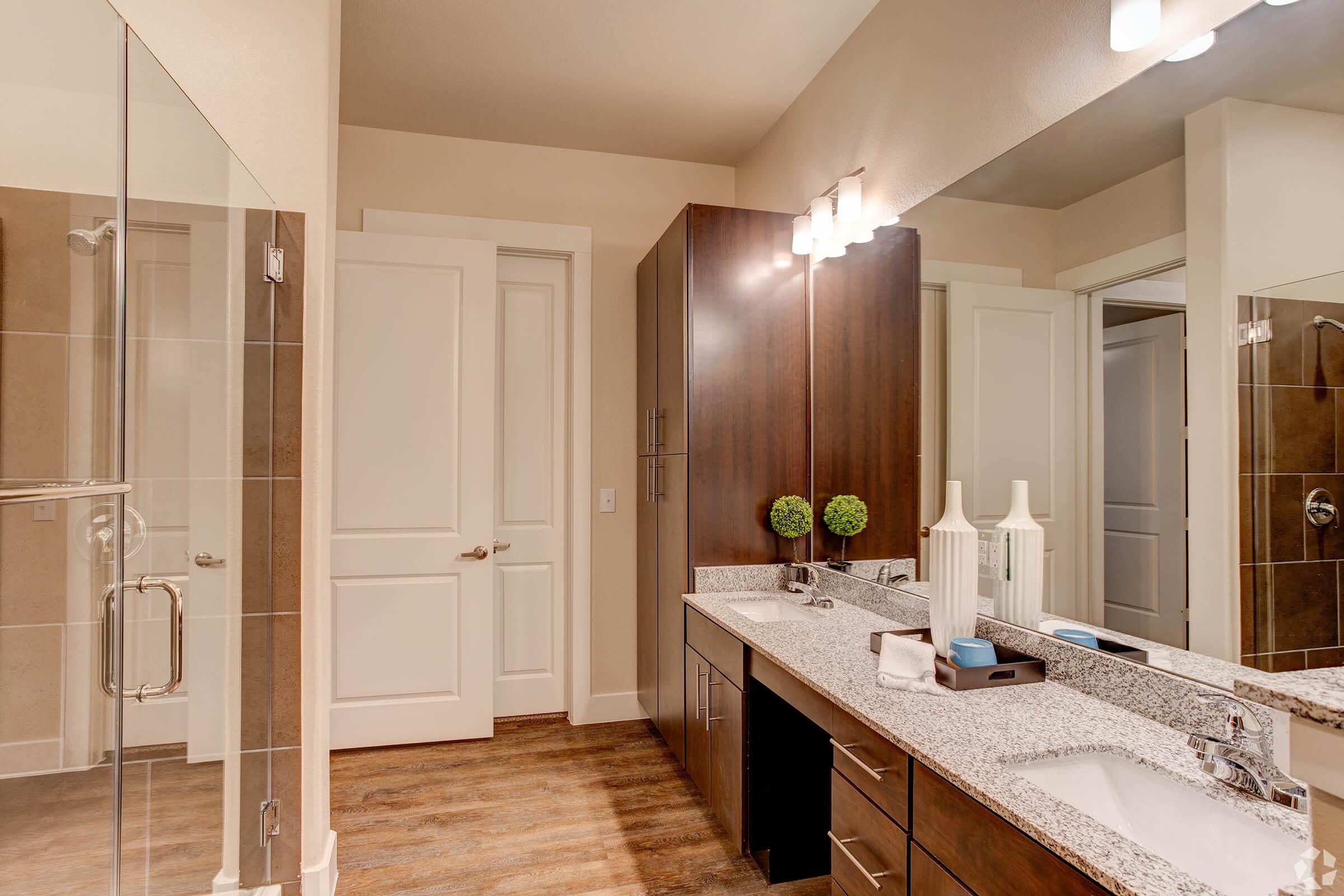 a kitchen with a sink and a mirror