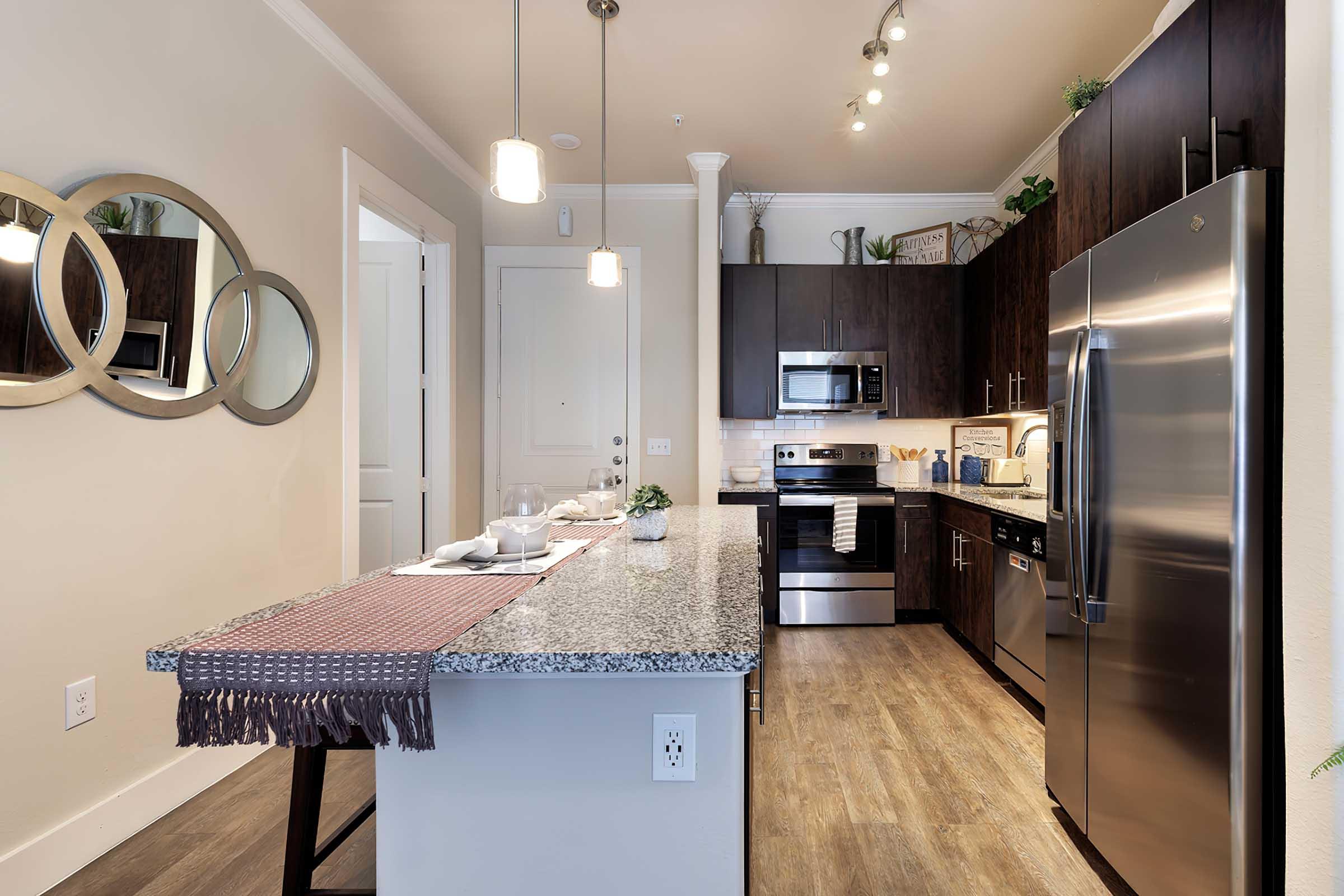 a modern kitchen with stainless steel appliances