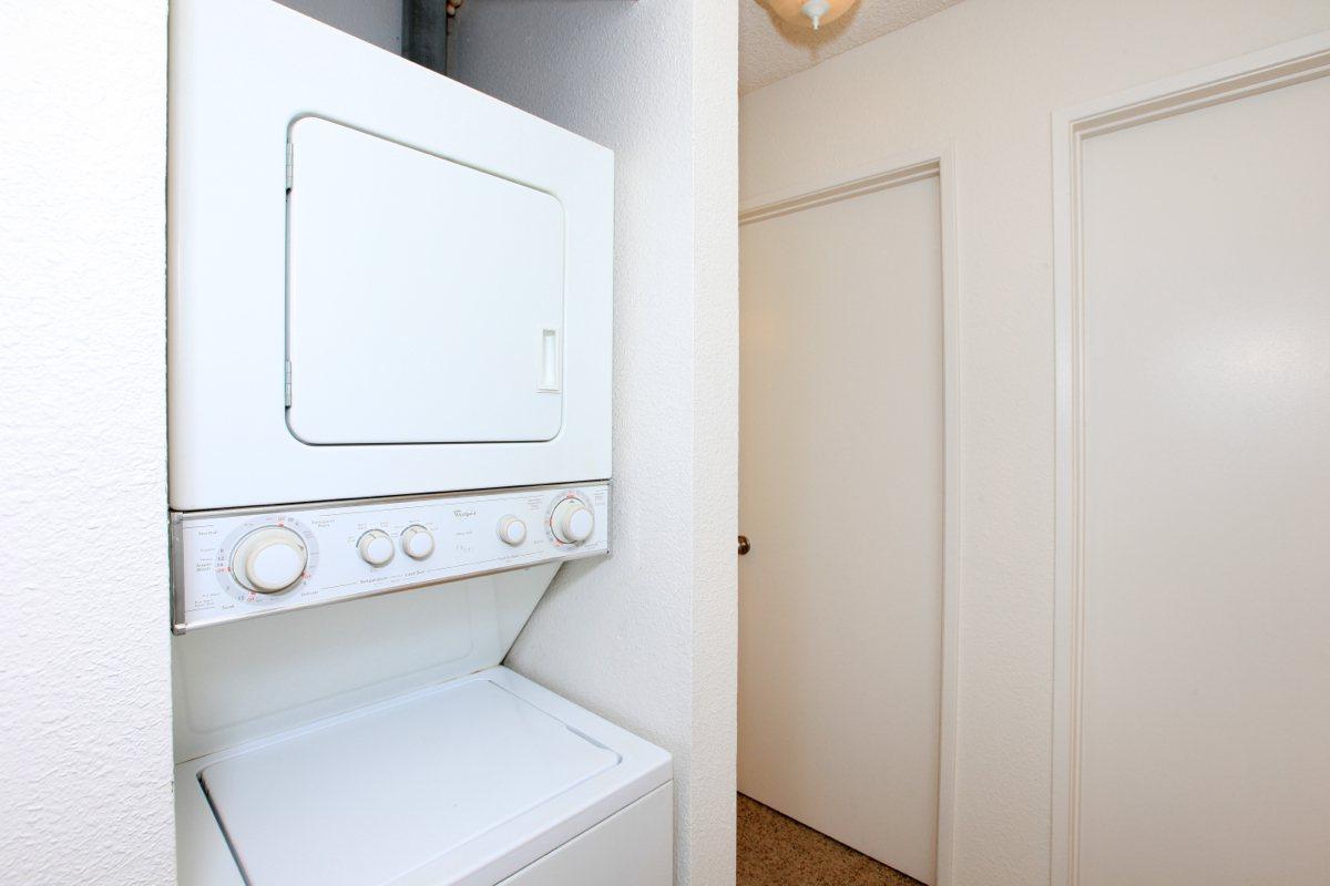 a white microwave oven sitting on top of a door