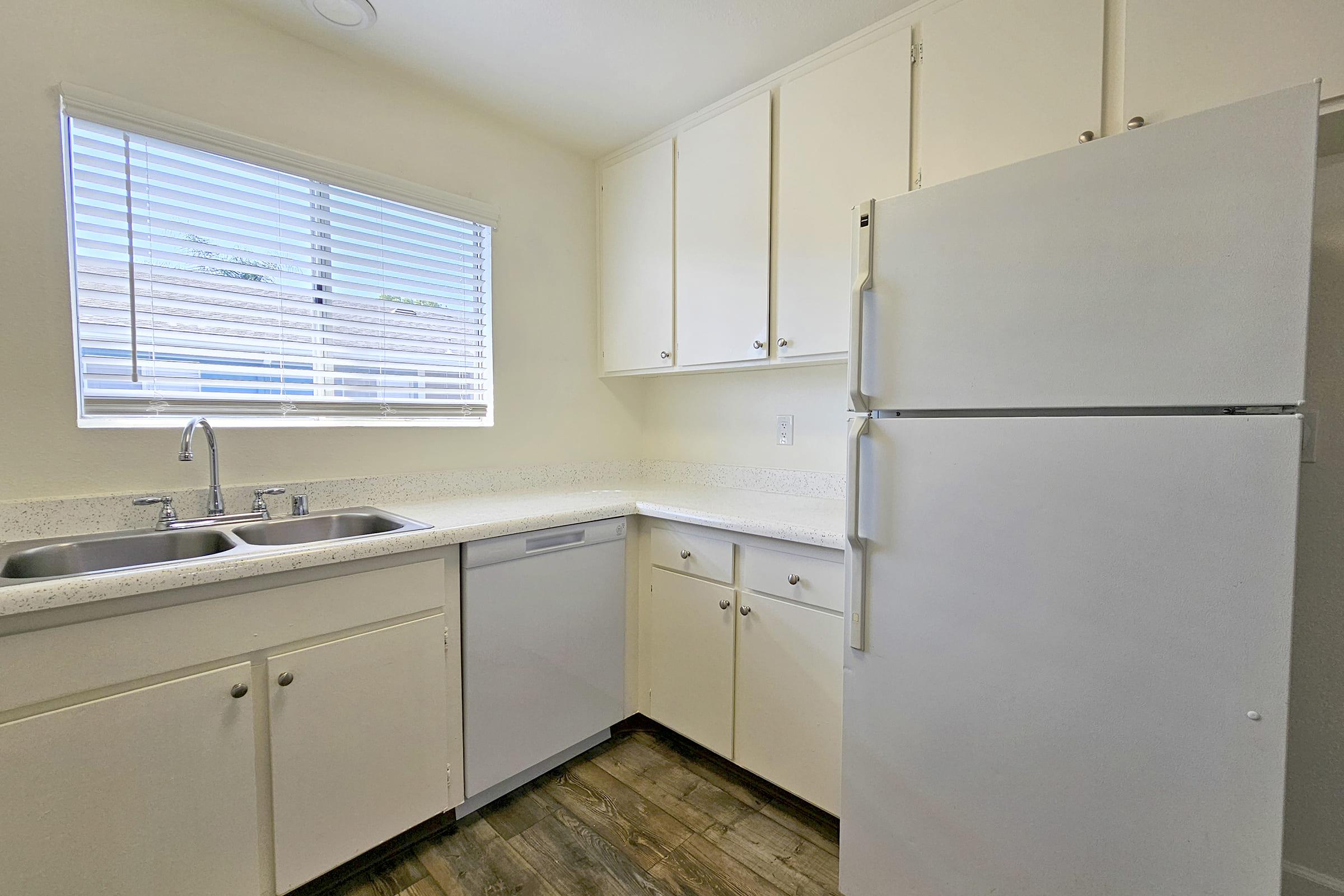 a kitchen with a stove and a refrigerator