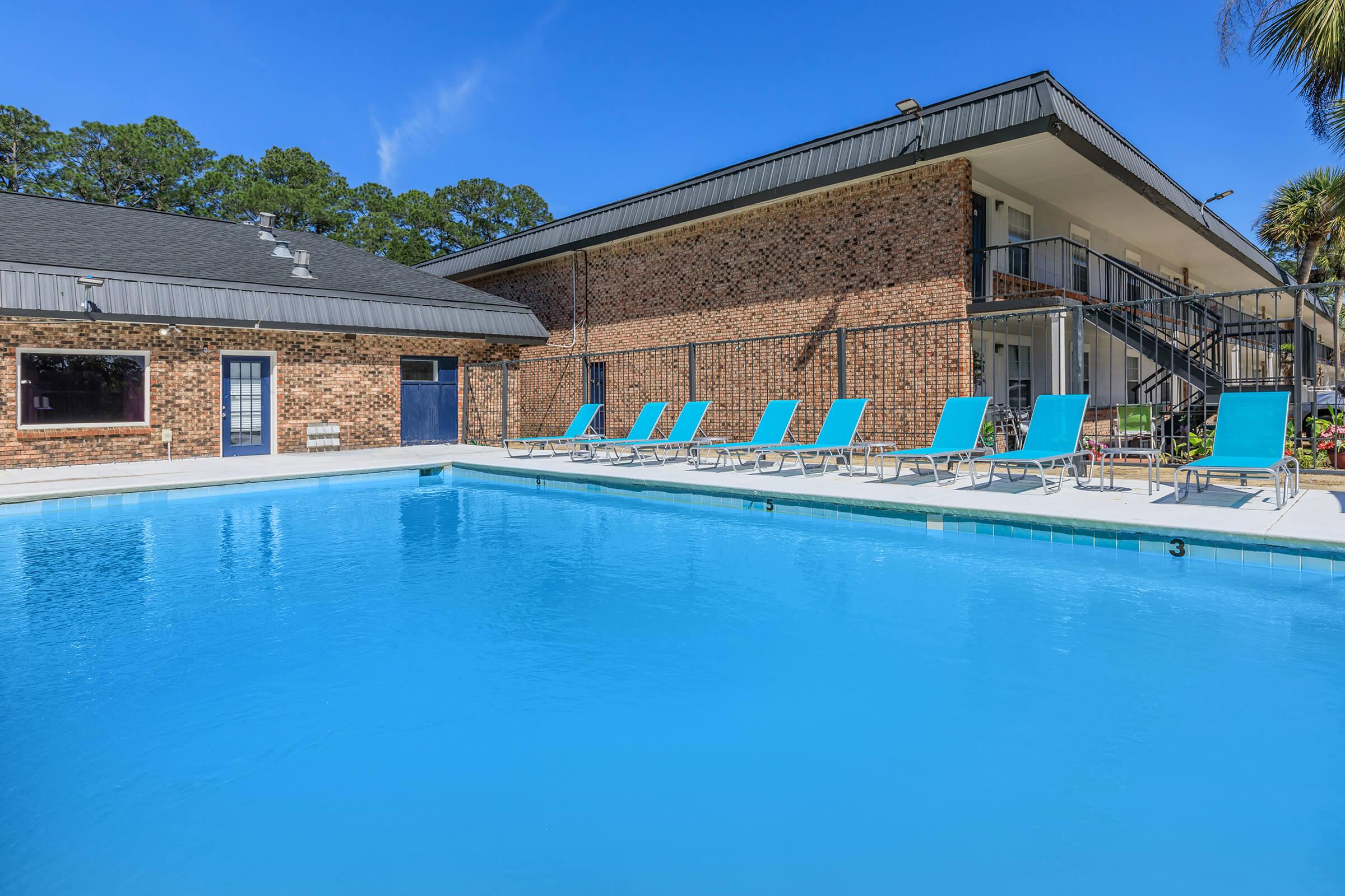 a large pool of water in front of a house