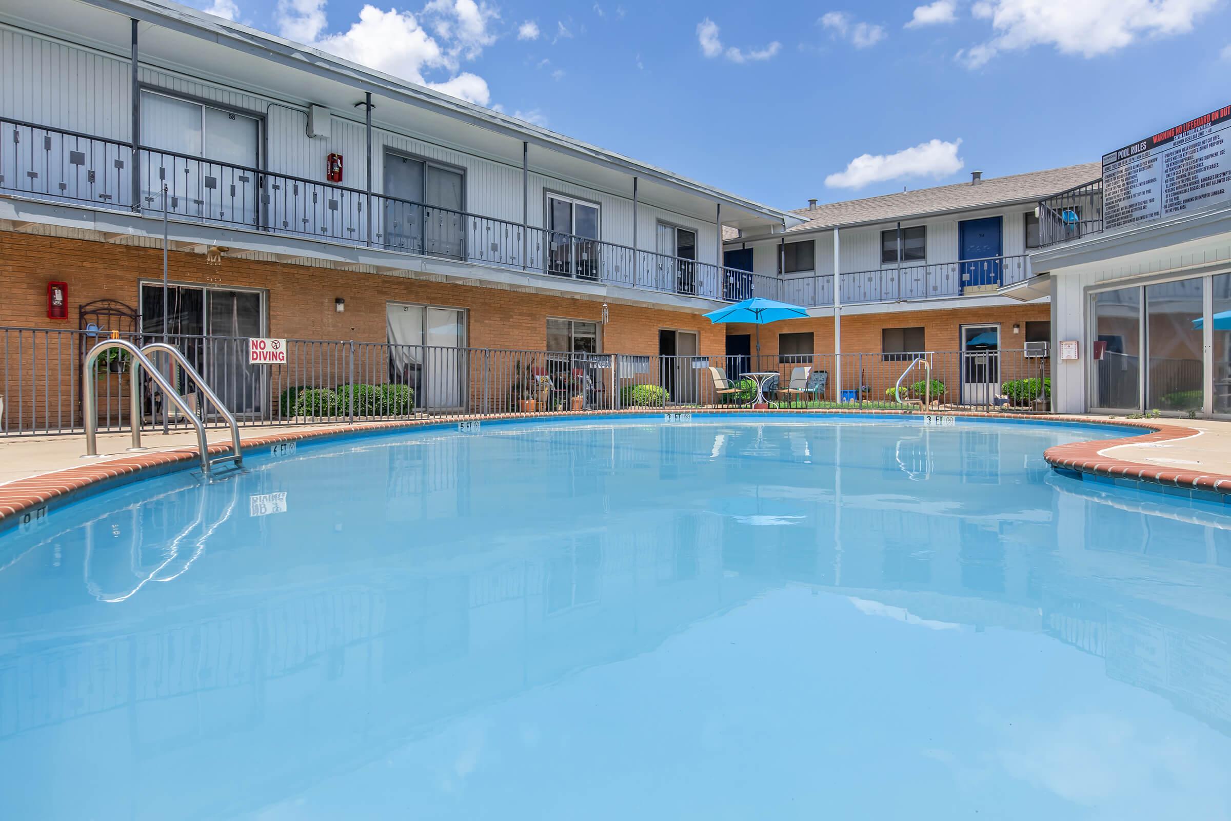 a large pool of water in front of a building