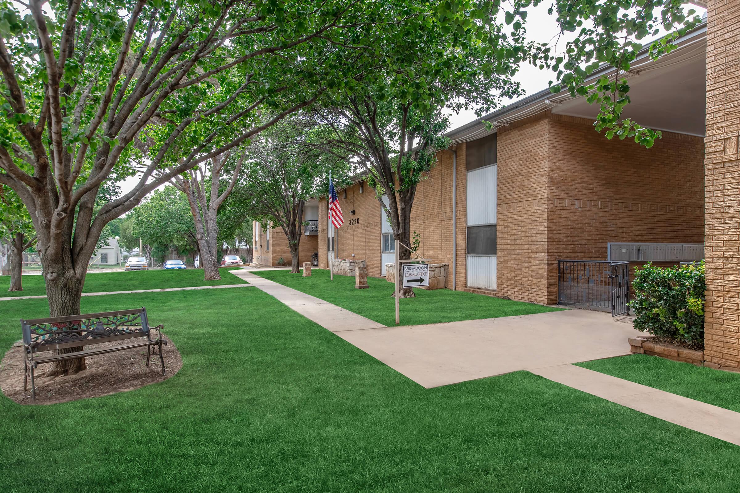 a large lawn in front of a house