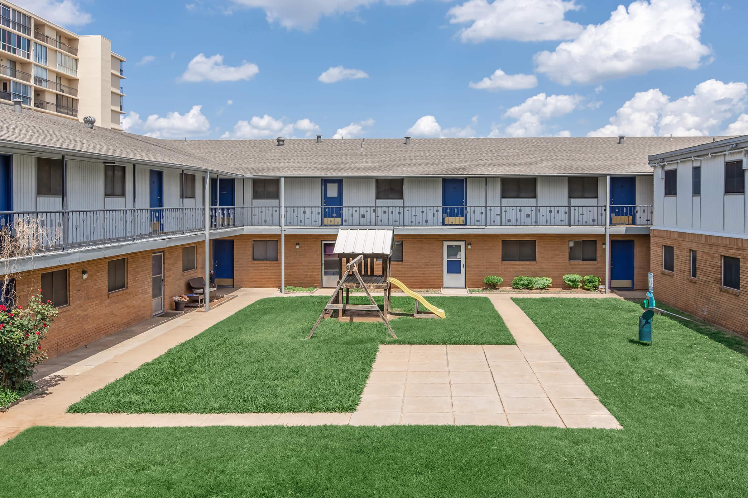 a large lawn in front of a building