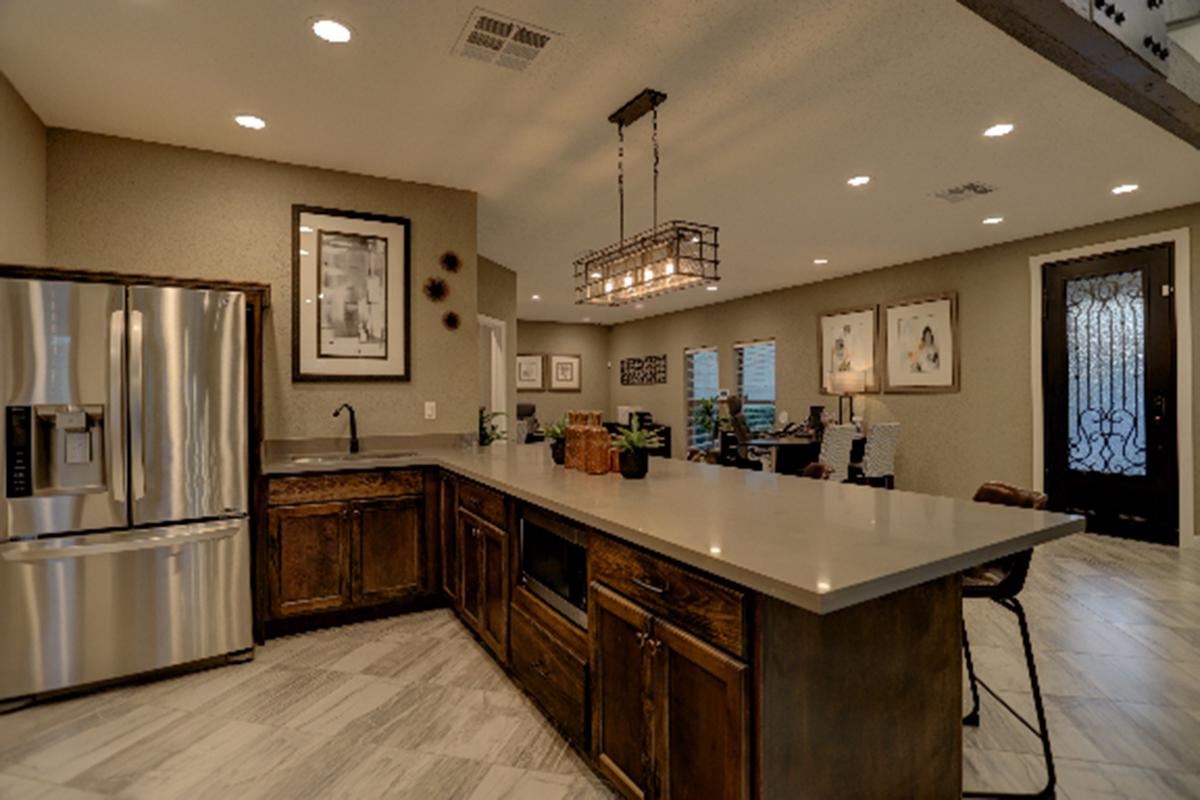 a kitchen with an island in the middle of a room