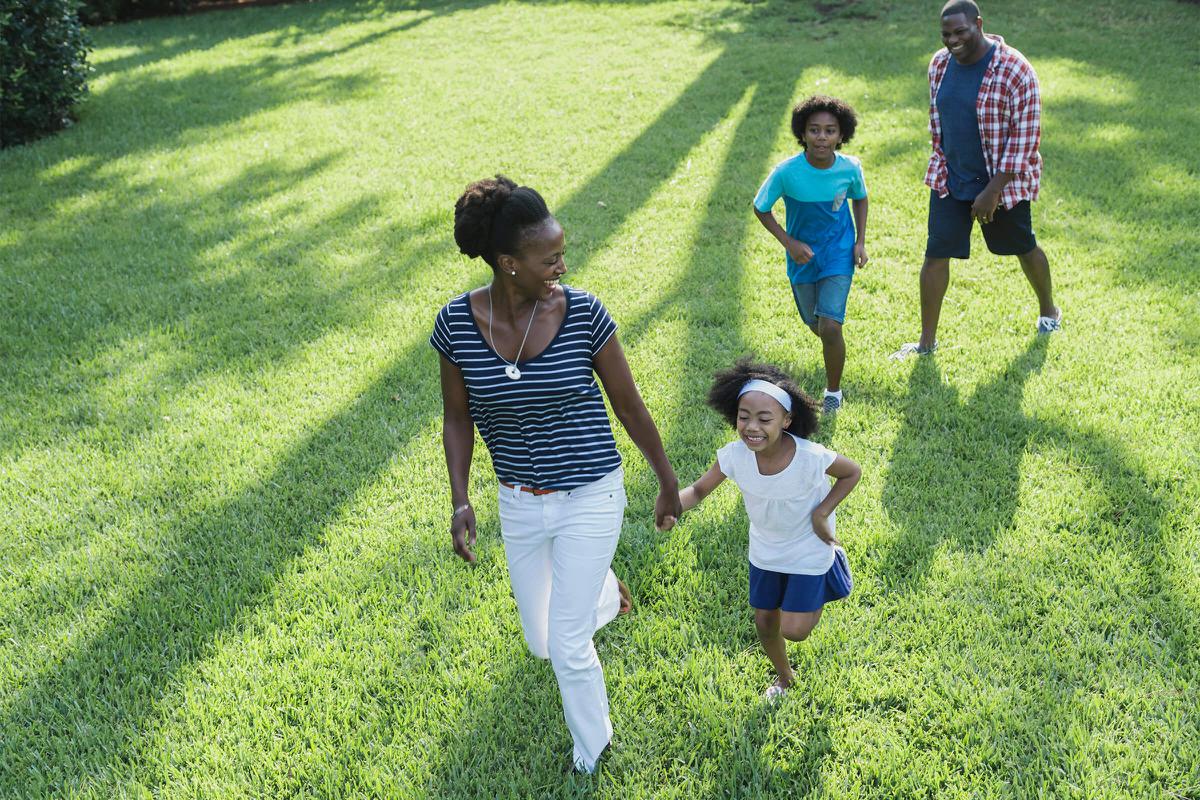 Family with mixed race children outdoor playing, walking iStock-541134950.jpg
