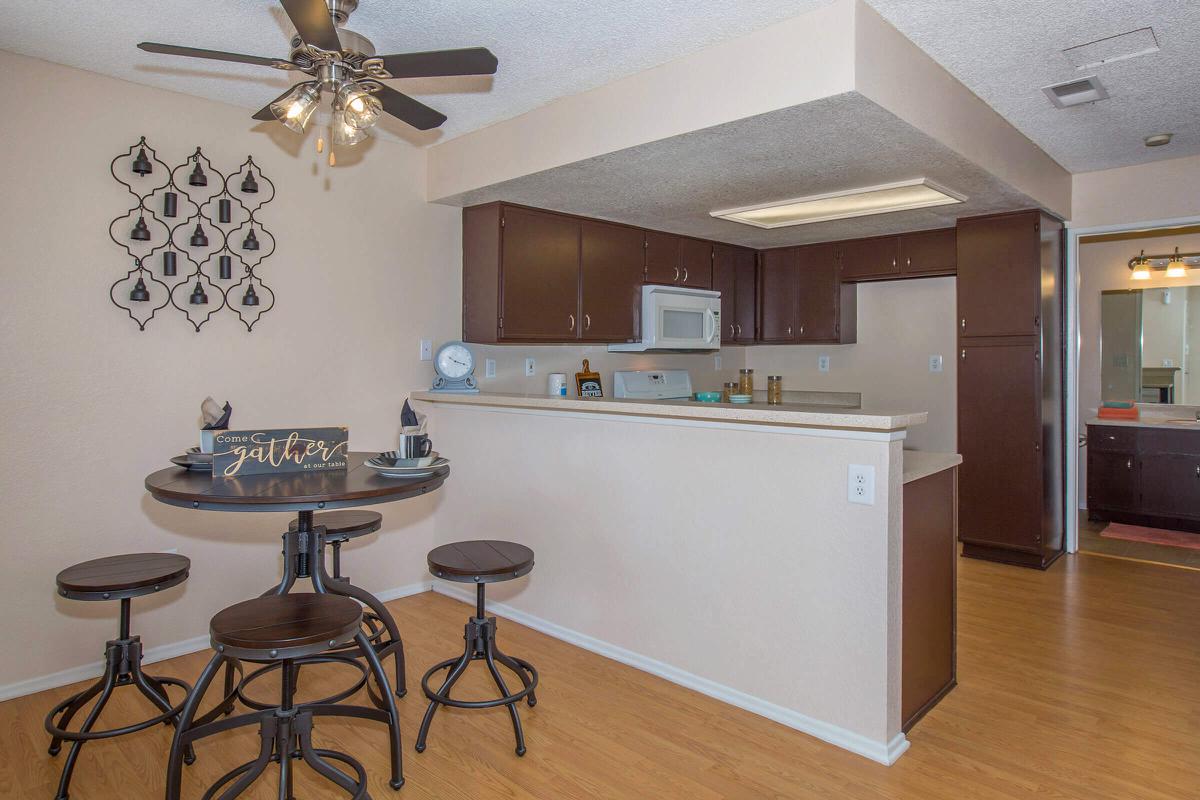a kitchen with a table in a room