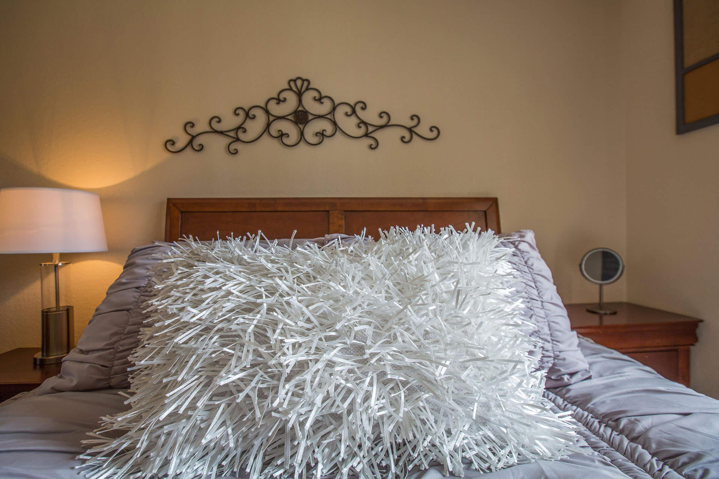 a made bed in a bedroom