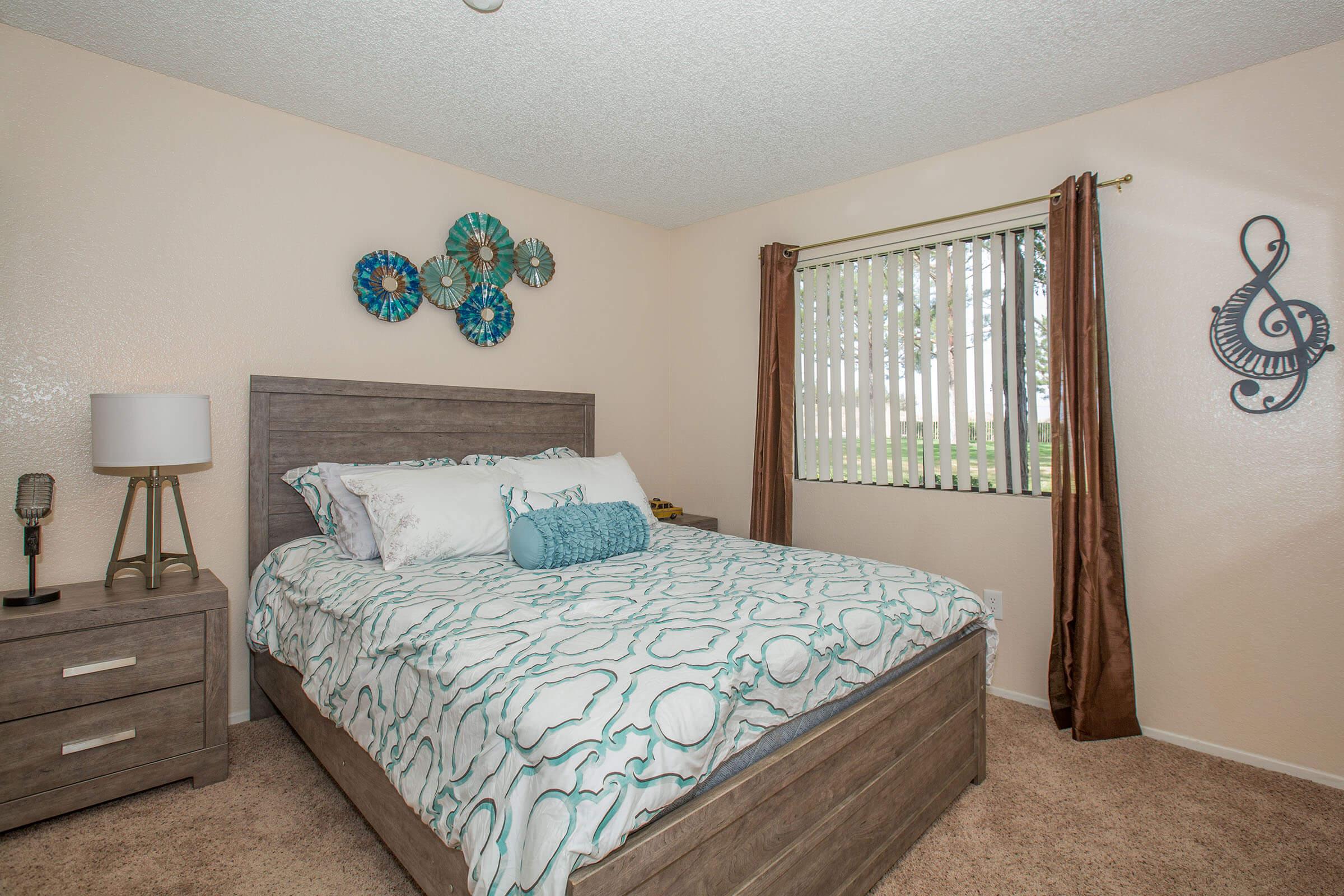 a bedroom with a bed in a room