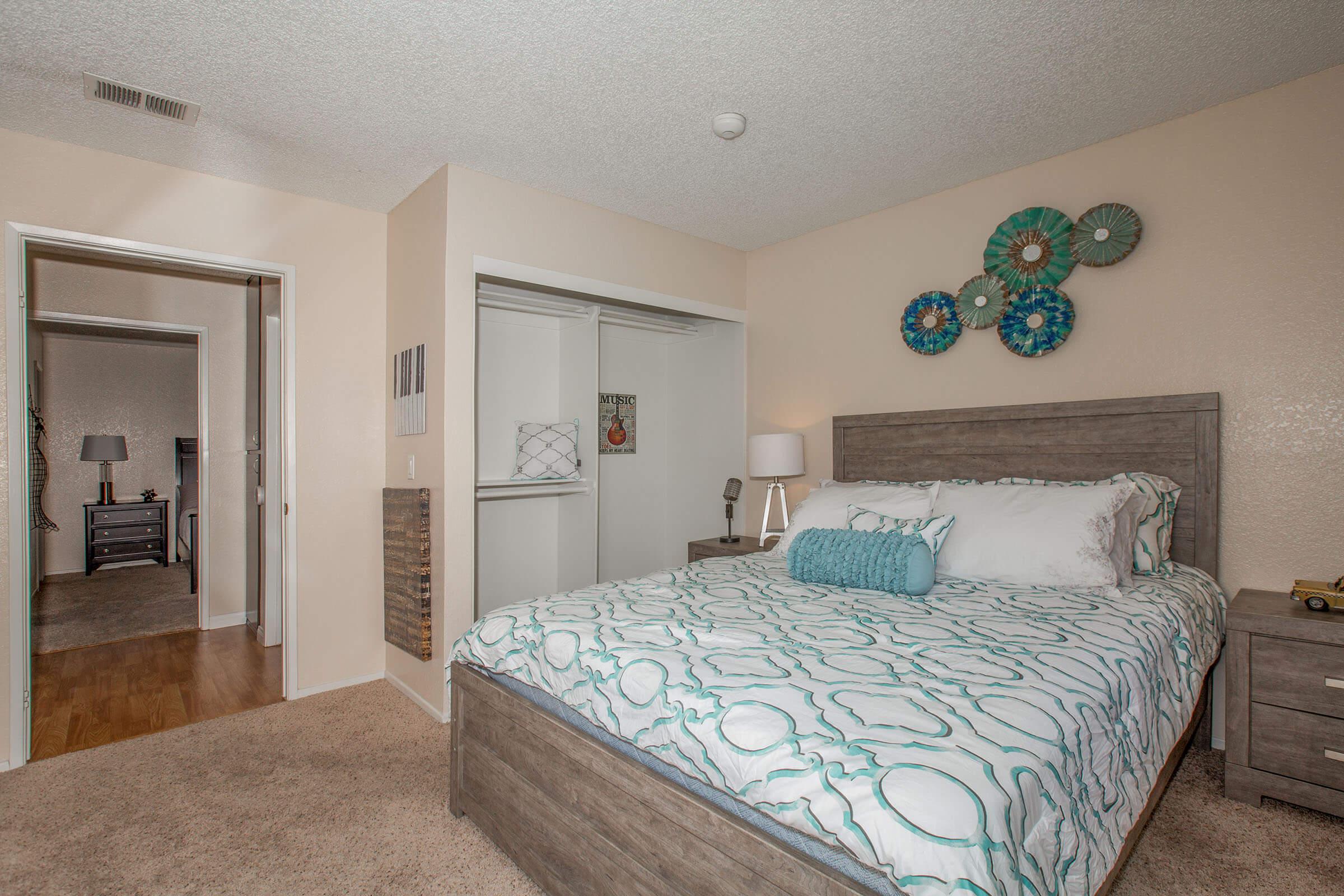 a bedroom with a bed in a room