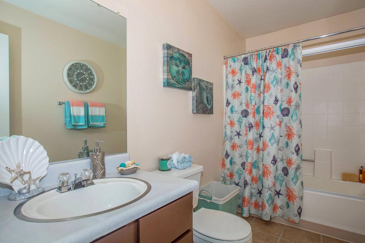 a room with a sink and a mirror