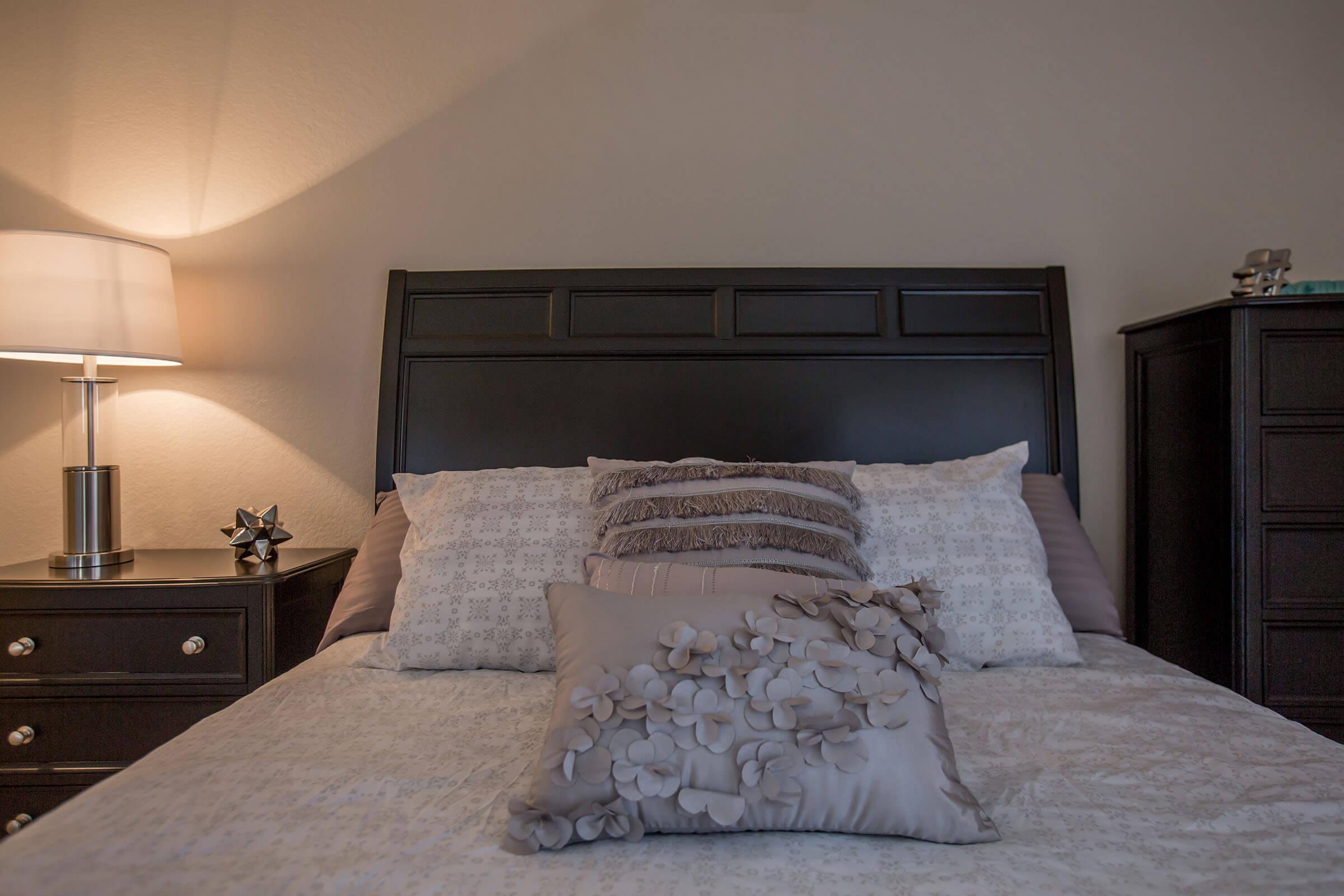 a bedroom with a large bed in a hotel room